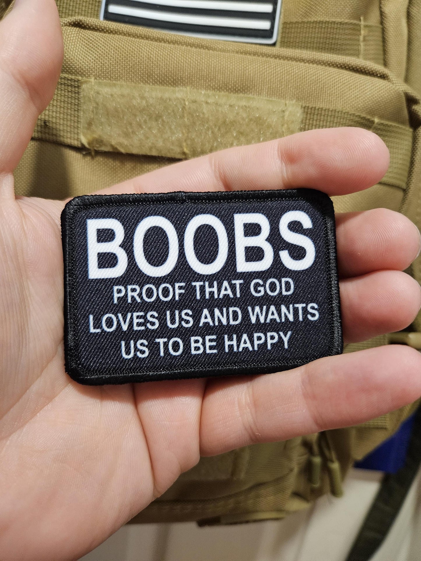 Boobs proof that God loves us and wants us to be happy meme 2"x3" removable morale patch with hook and loop backing black and white