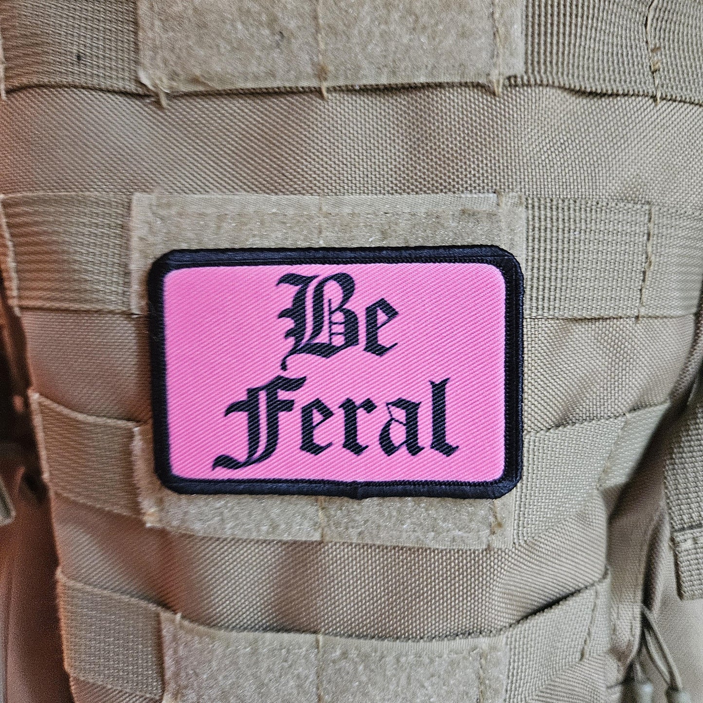 Pink "be feral" girls and boys meme 2"x3" morale patch with hook and loop backing
