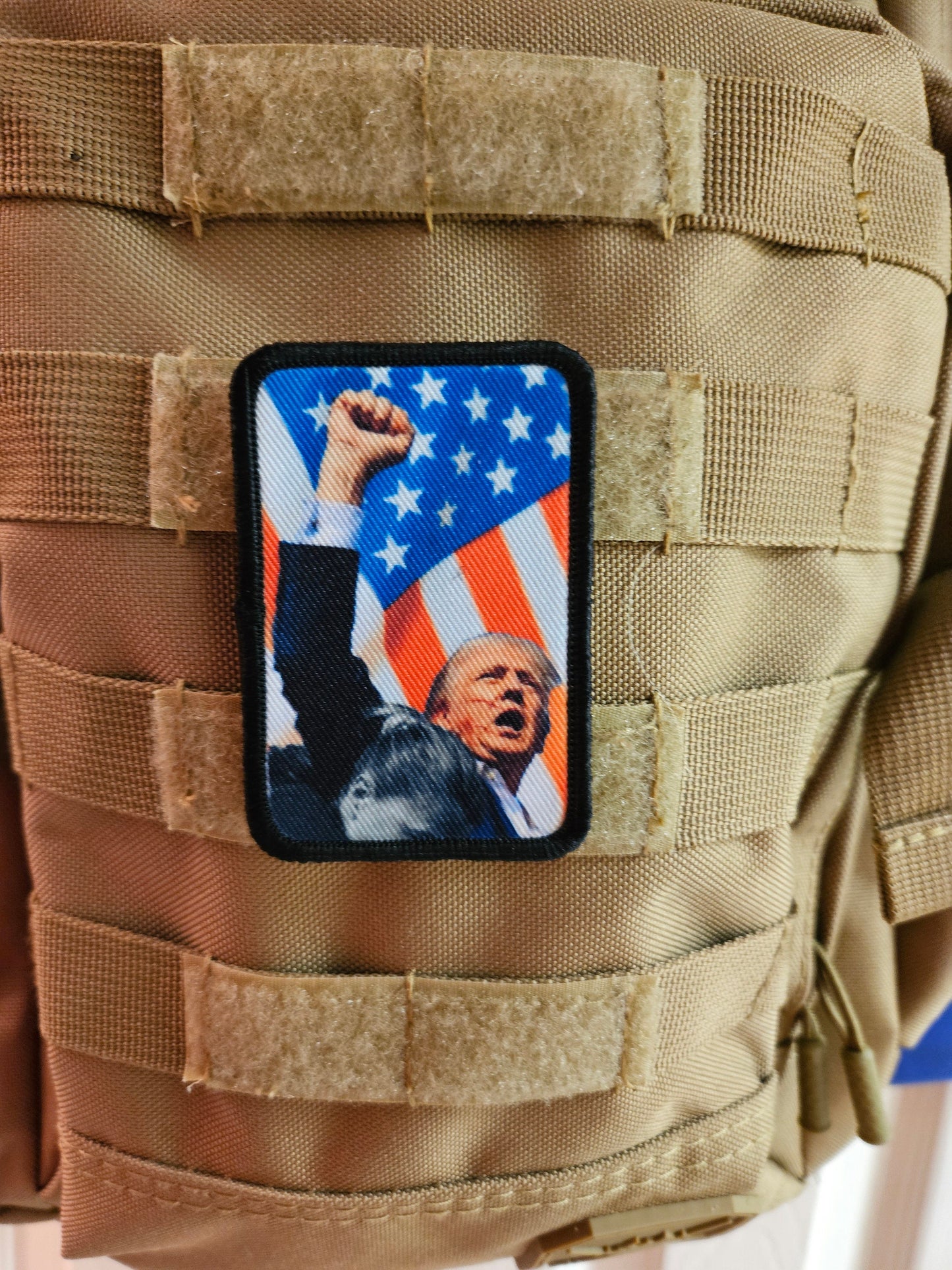 Flag background donald fist in the air 2"x3" morale patch with hook and loop backing military joke meme