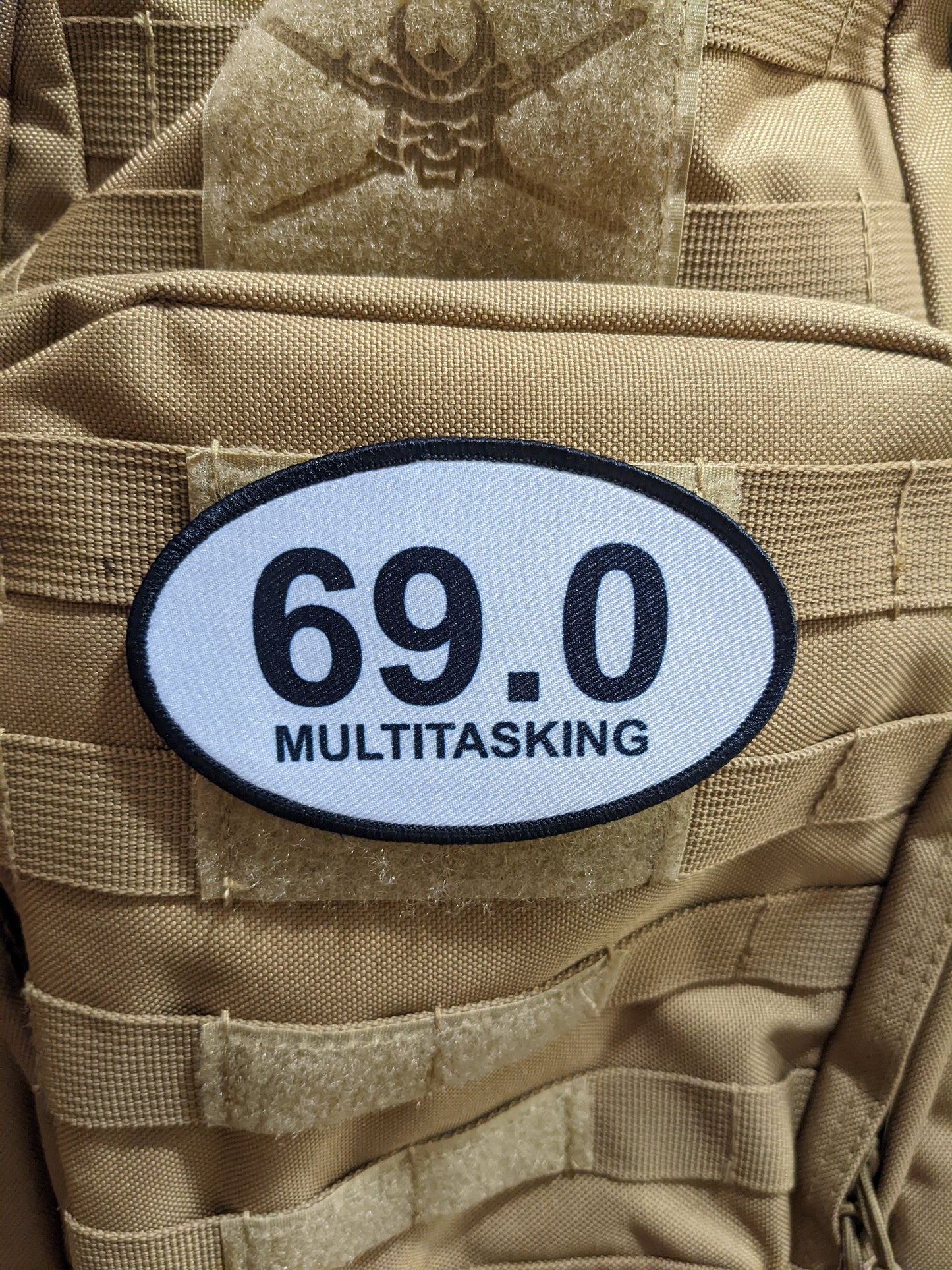 69 multitasking celebration joke 4"x2.5" oval morale patch with hook and loop backing