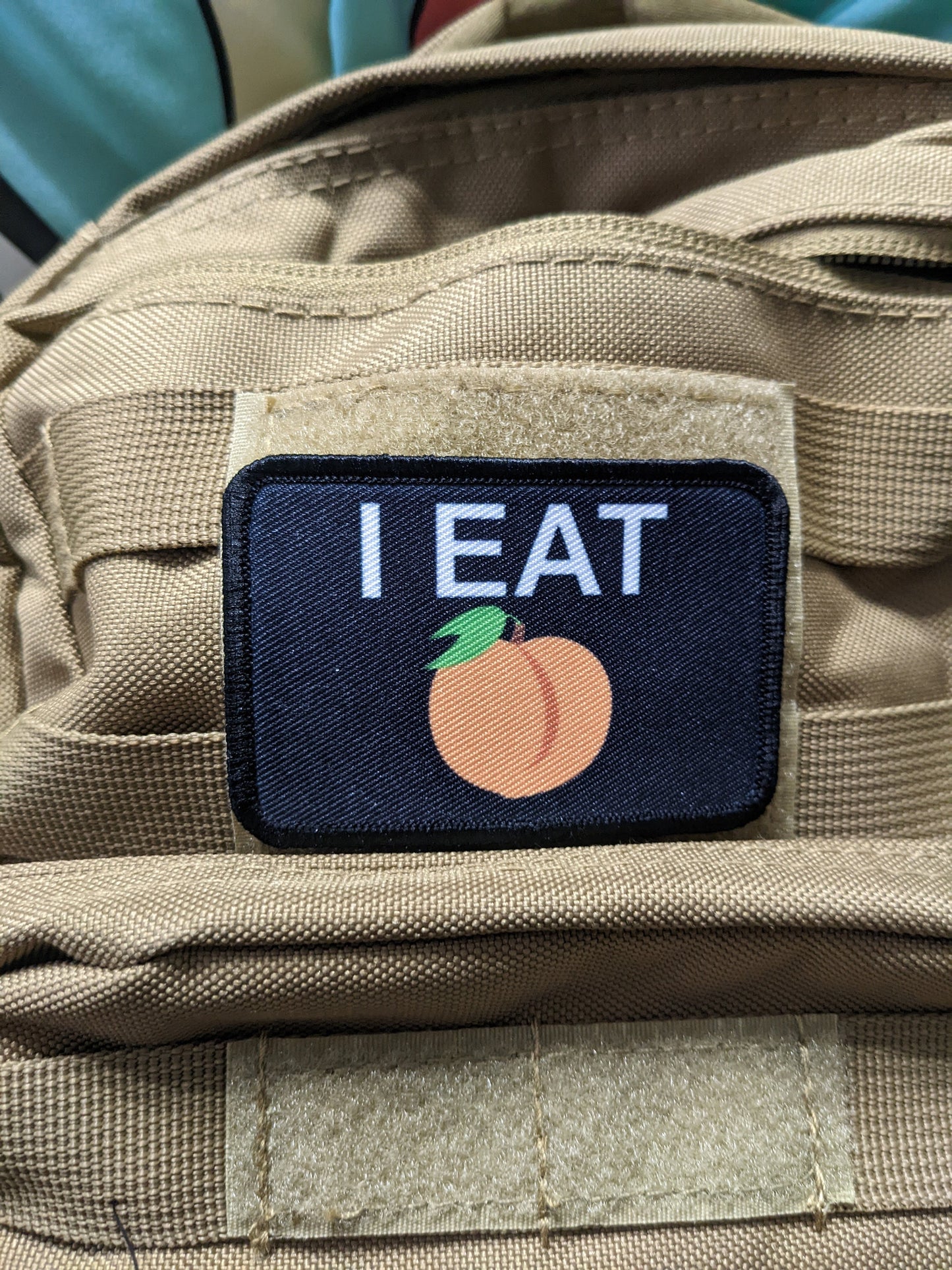 I eat peaches meme funny food black background 2"x3" removable morale patch with hook and loop backing