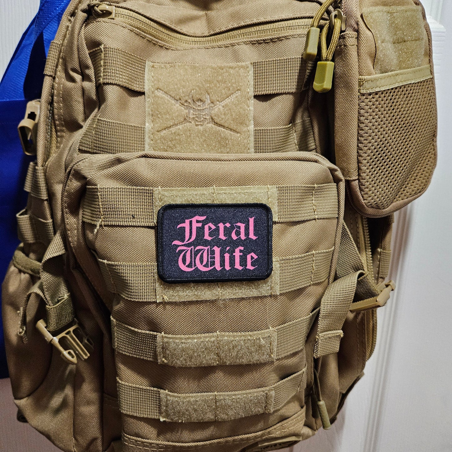 Feral wife meme 2"x3" morale patch with hook and loop backing pink on black