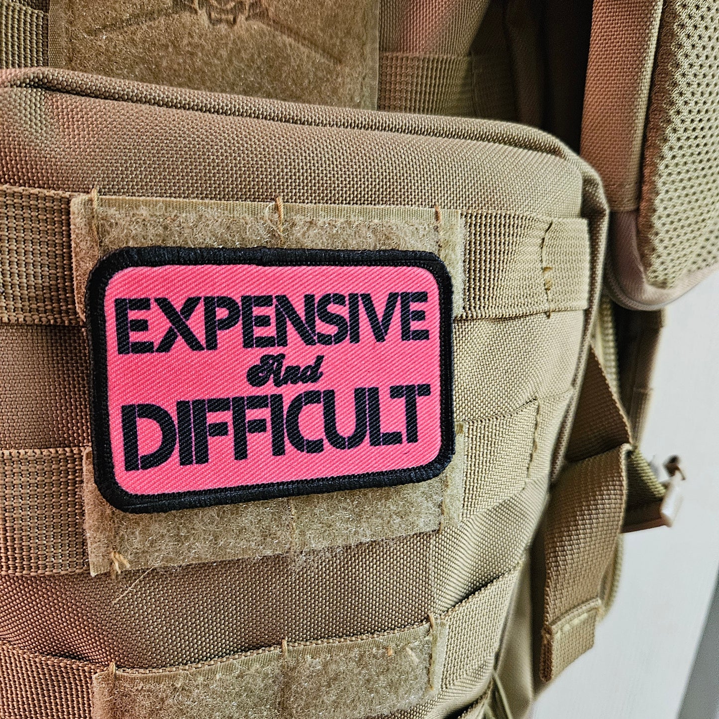 Expensive and difficult meme pink 2"x3" removable morale patch with hook and loop backing