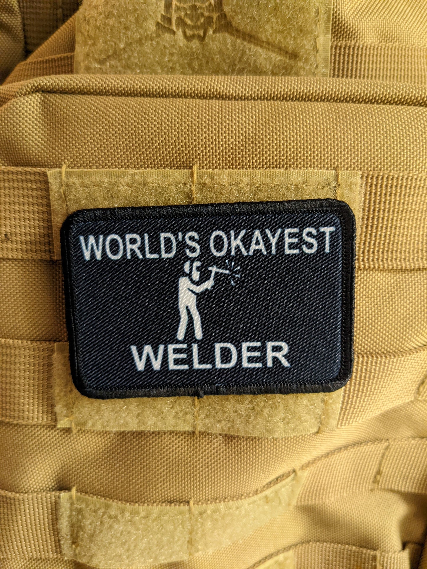 World's okayest Welder blue collar welding 2"x3" morale patch with hook and loop backing