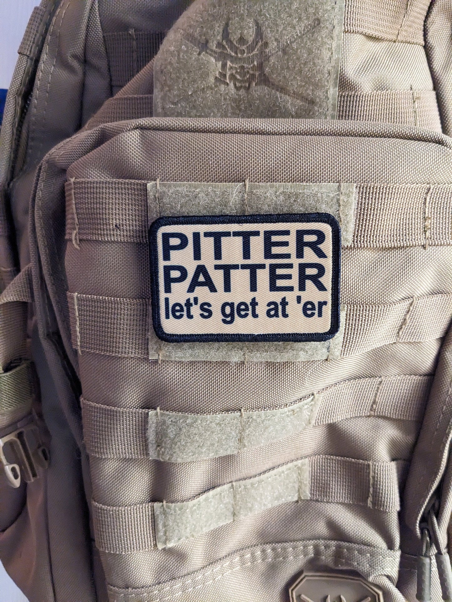 Pitter patter let's get at 'er meme 2"x3" removable morale patch with hook and loop backing
