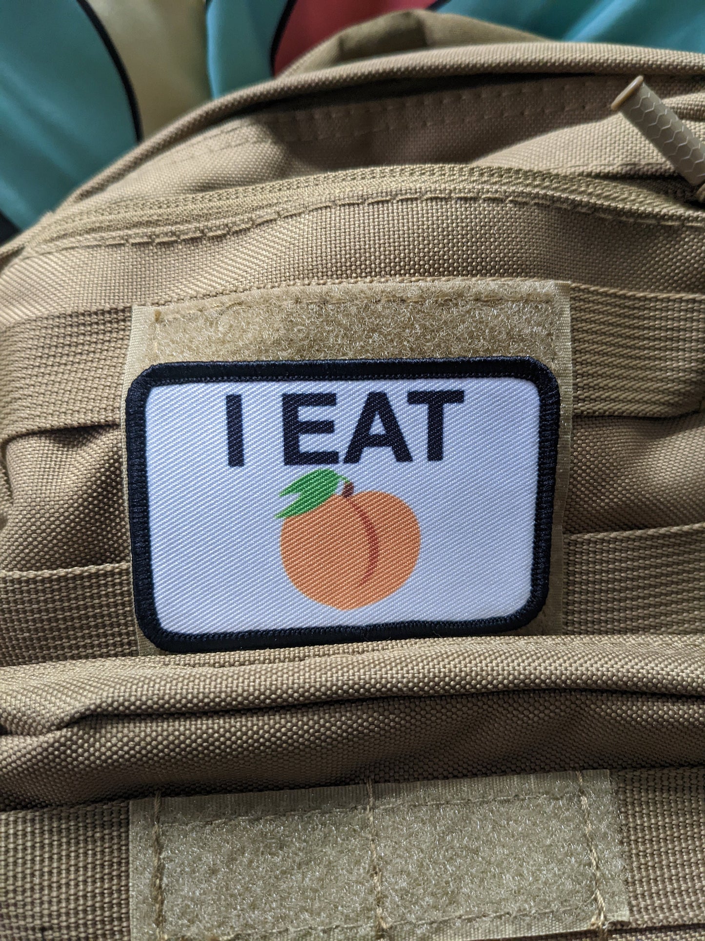 I eat peaches meme funny food white background  2"x3" removable morale patch with hook and loop backing