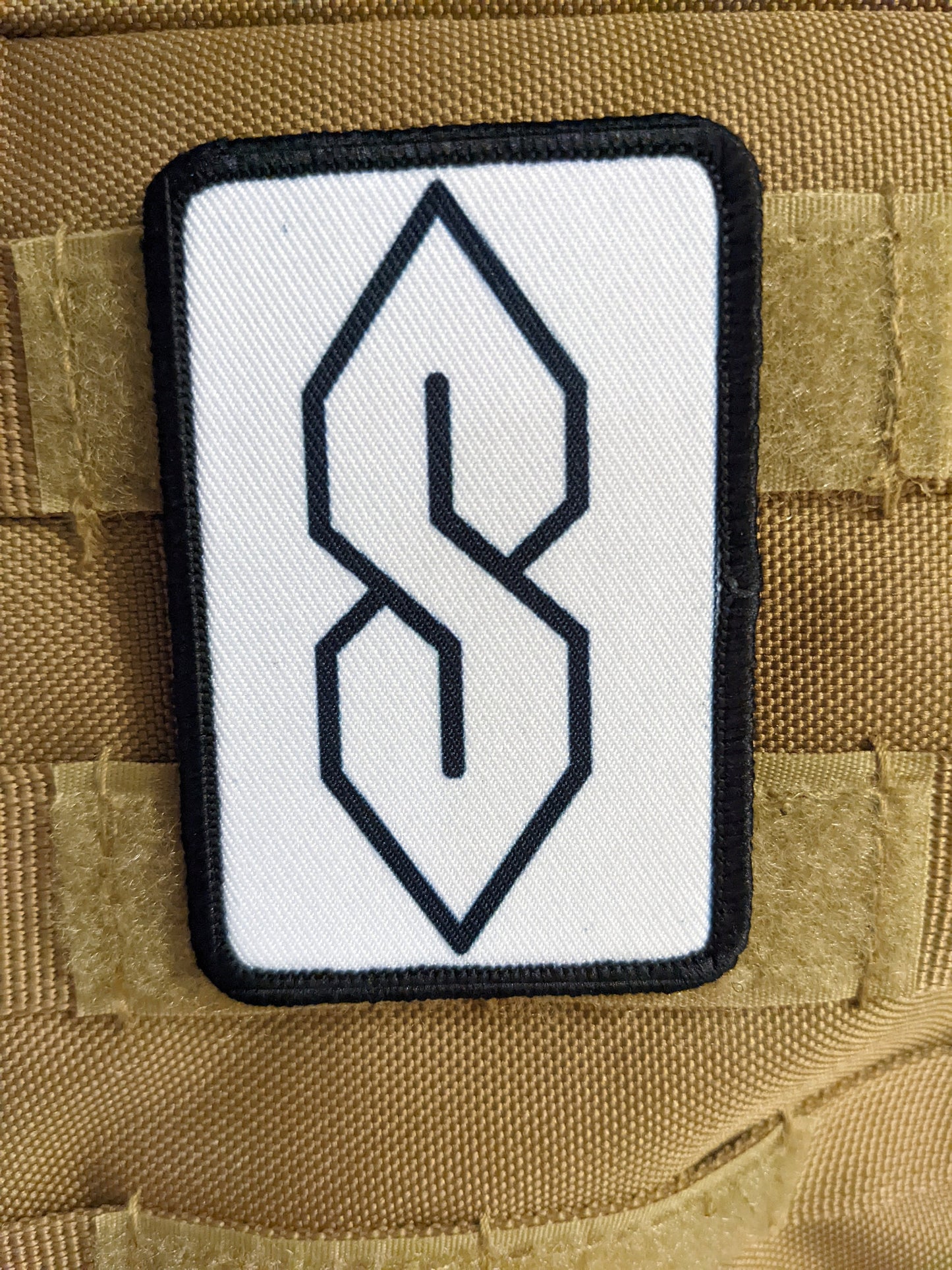 90s "S" shape drawing ancient meme knowledge white 2"x3" morale patch with hook and loop backing