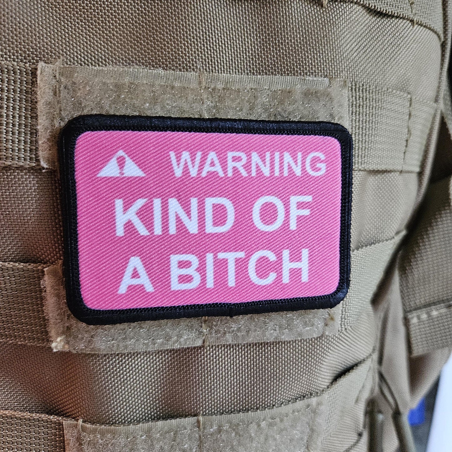 Warning kind of a bitch patch 2"x3" removable morale patch with hook and loop backing pink