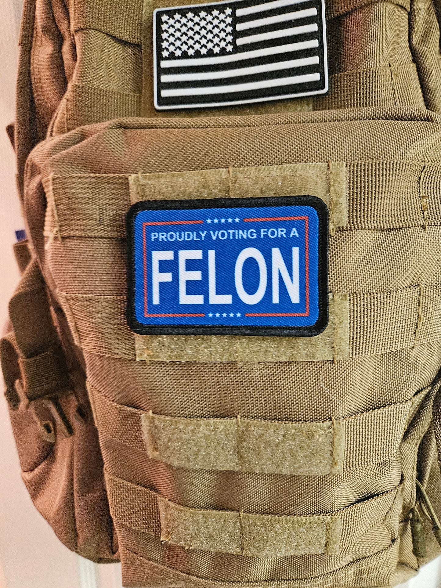 Proudly voting for a felon blue 2"x3" removable morale patch with hook and loop backing meme