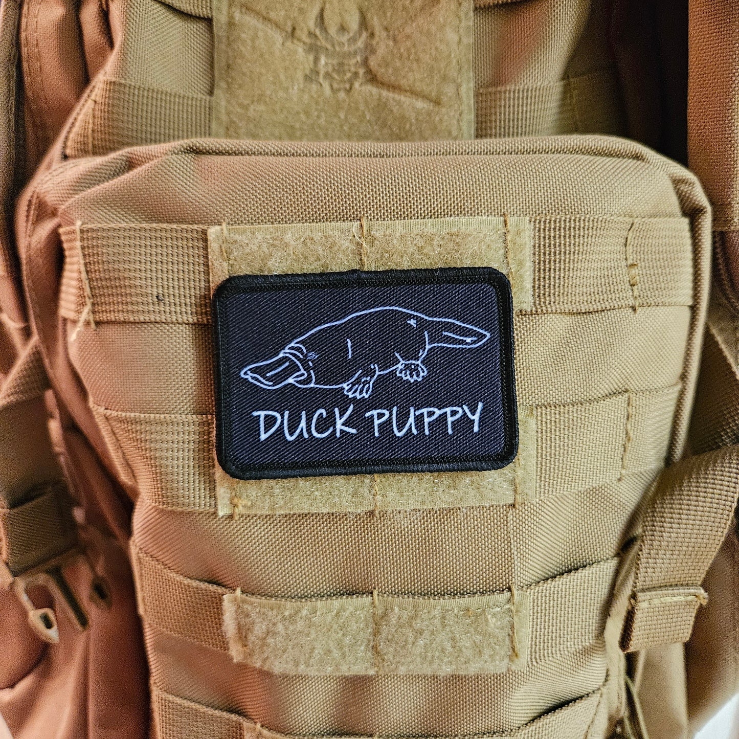 Duck puppy duck billed platypus black meme funny  2"x3" morale patch with hook and loop backing