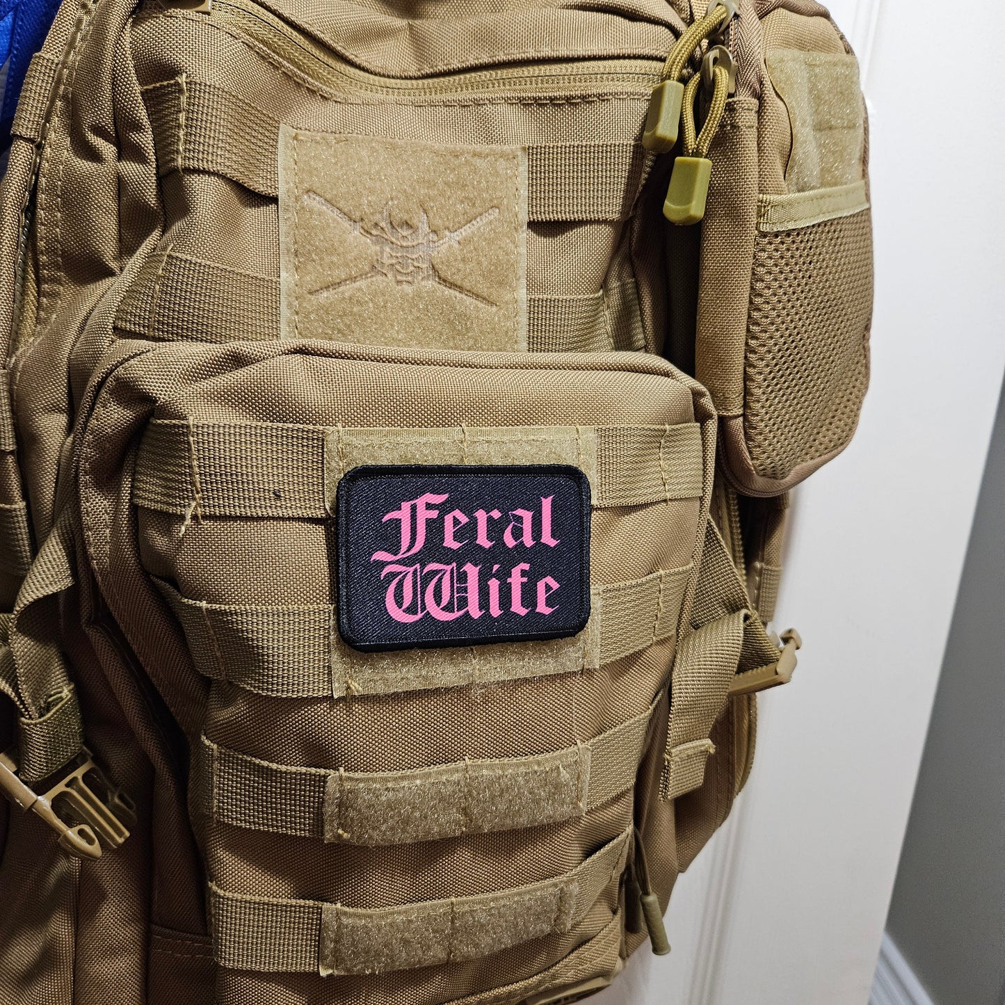 Feral wife meme 2"x3" morale patch with hook and loop backing pink on black