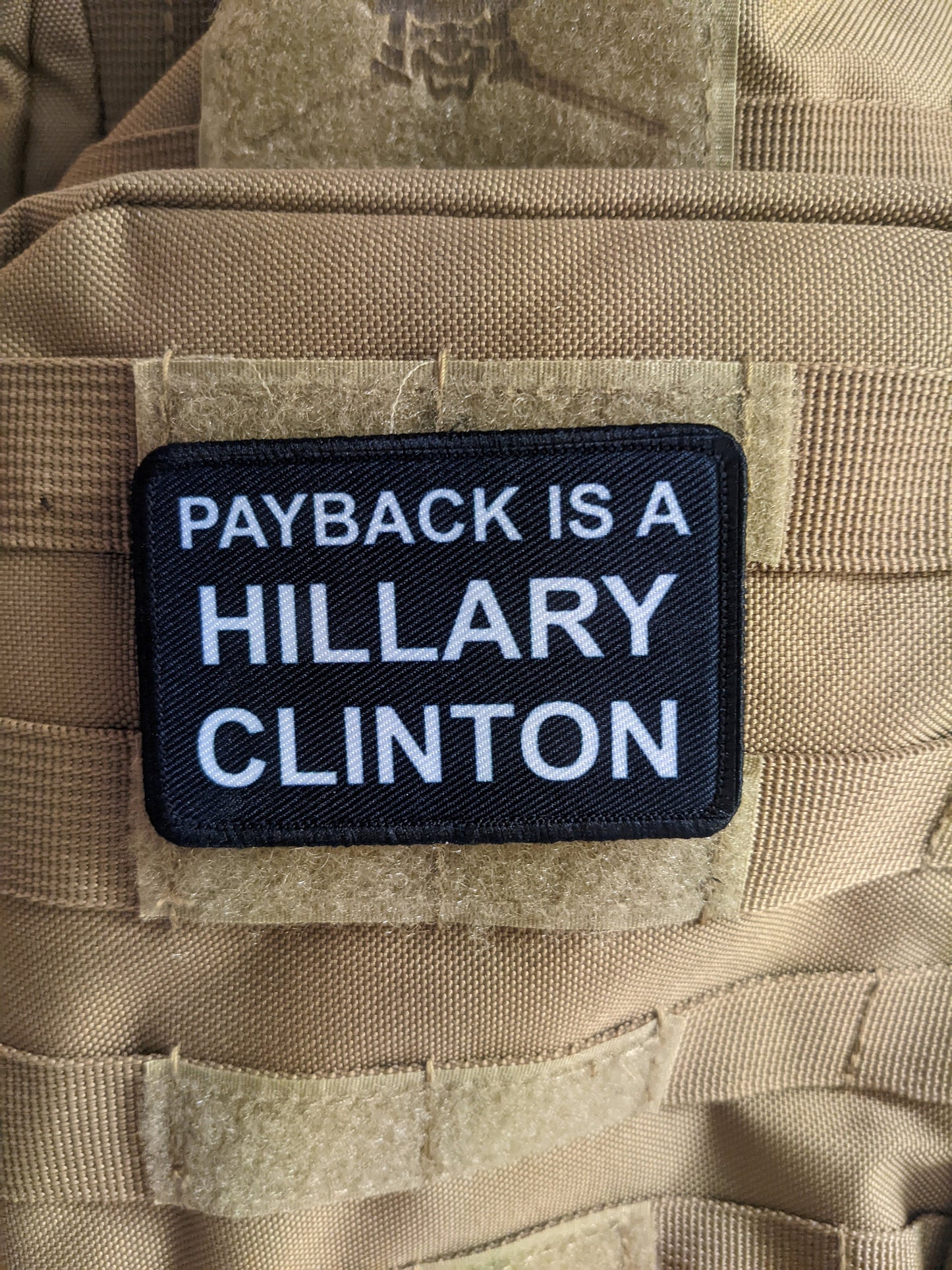 Payback is a Hillary Clinton (bitch) 2"x3" morale patch with hook and loop backing