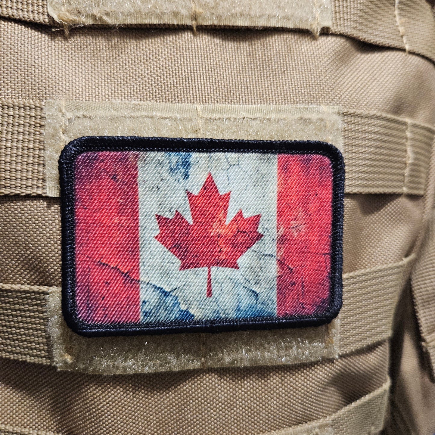 Distressed Canadian maple leaf flag 2"x3" morale patch with hook and loop backing