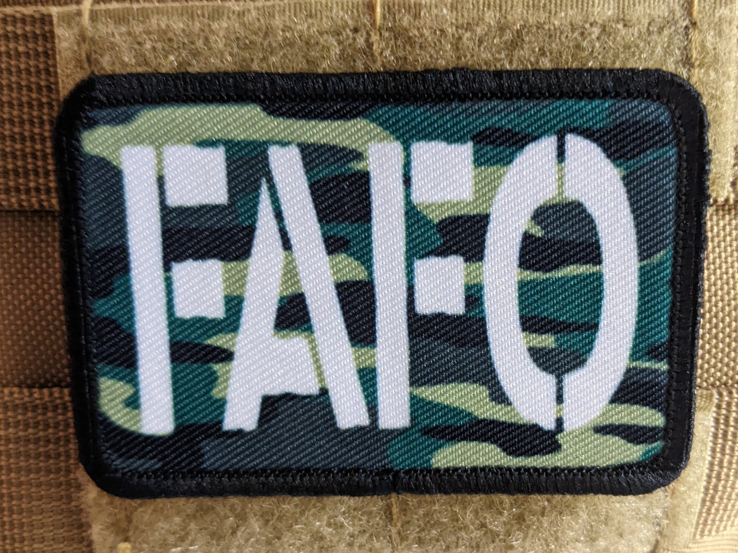 Fuck around and find out camo funny 2"x3" morale patch with hook and loop backing green background