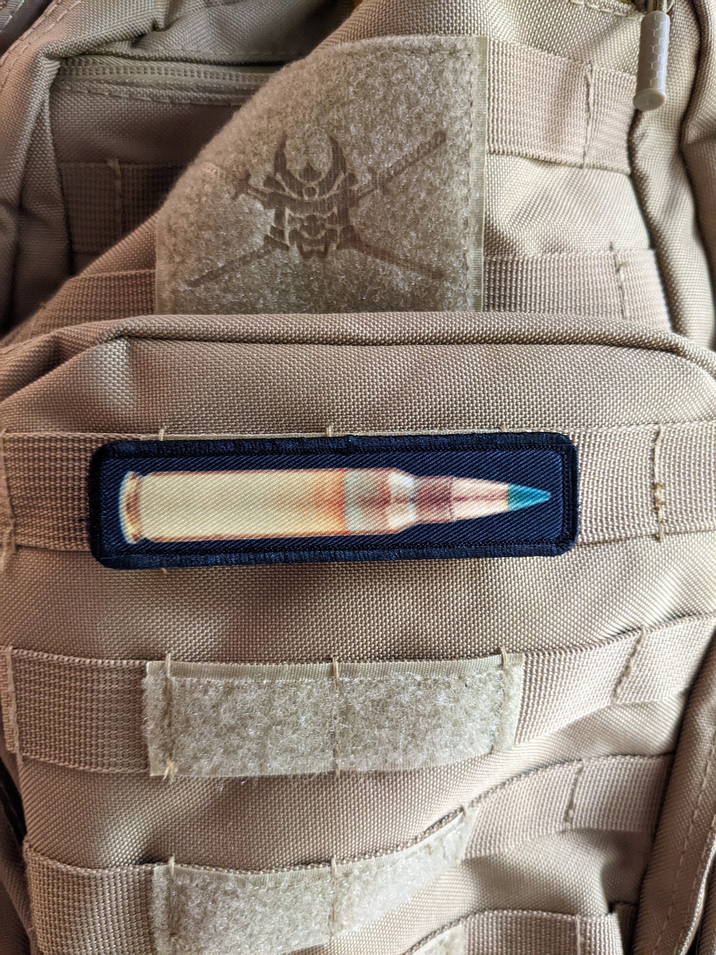 556 green tip round military 1"x4" removable morale patch with hook and loop backing good for back of operator hats