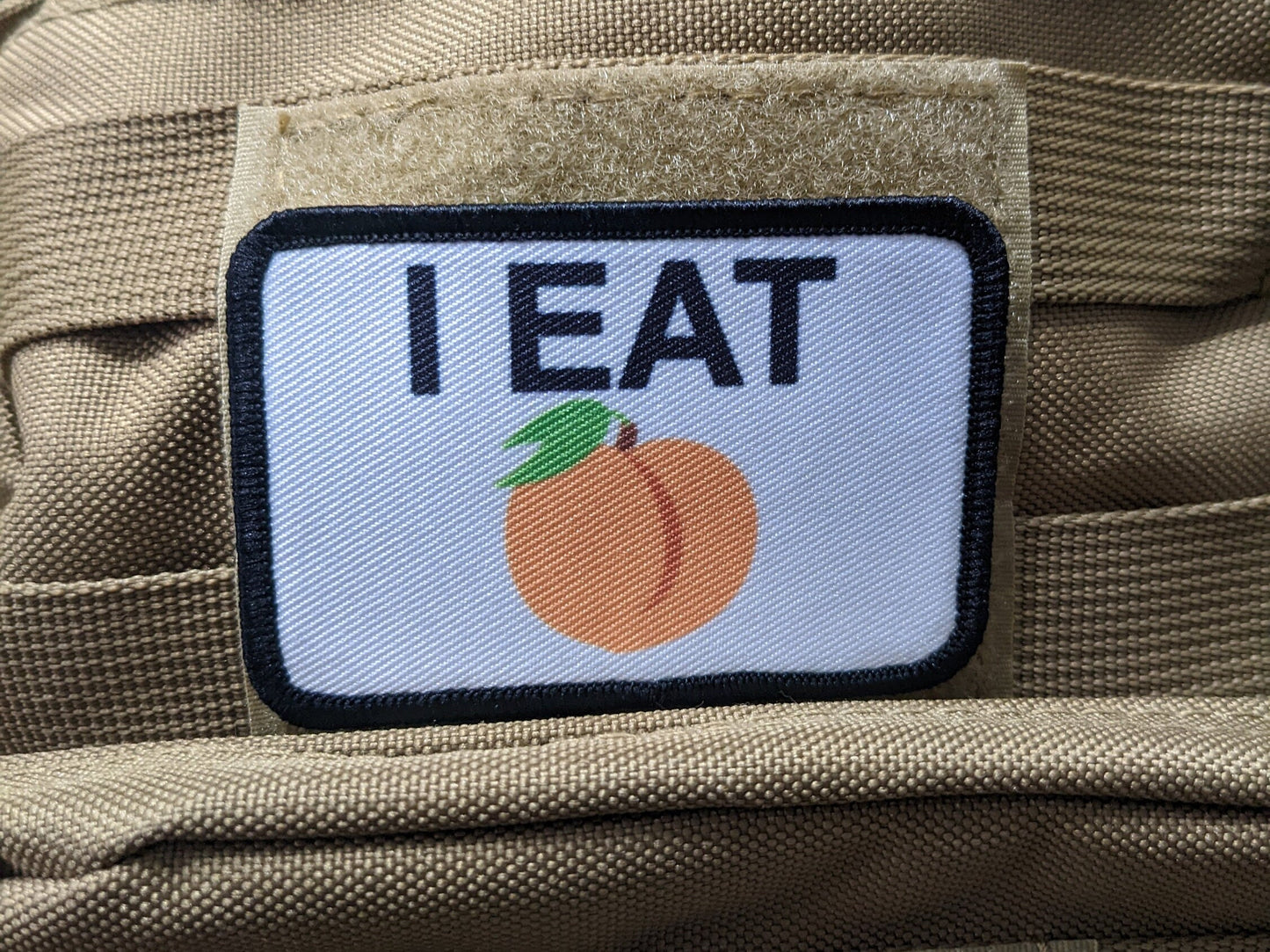 I eat peaches meme funny food white background  2"x3" removable morale patch with hook and loop backing