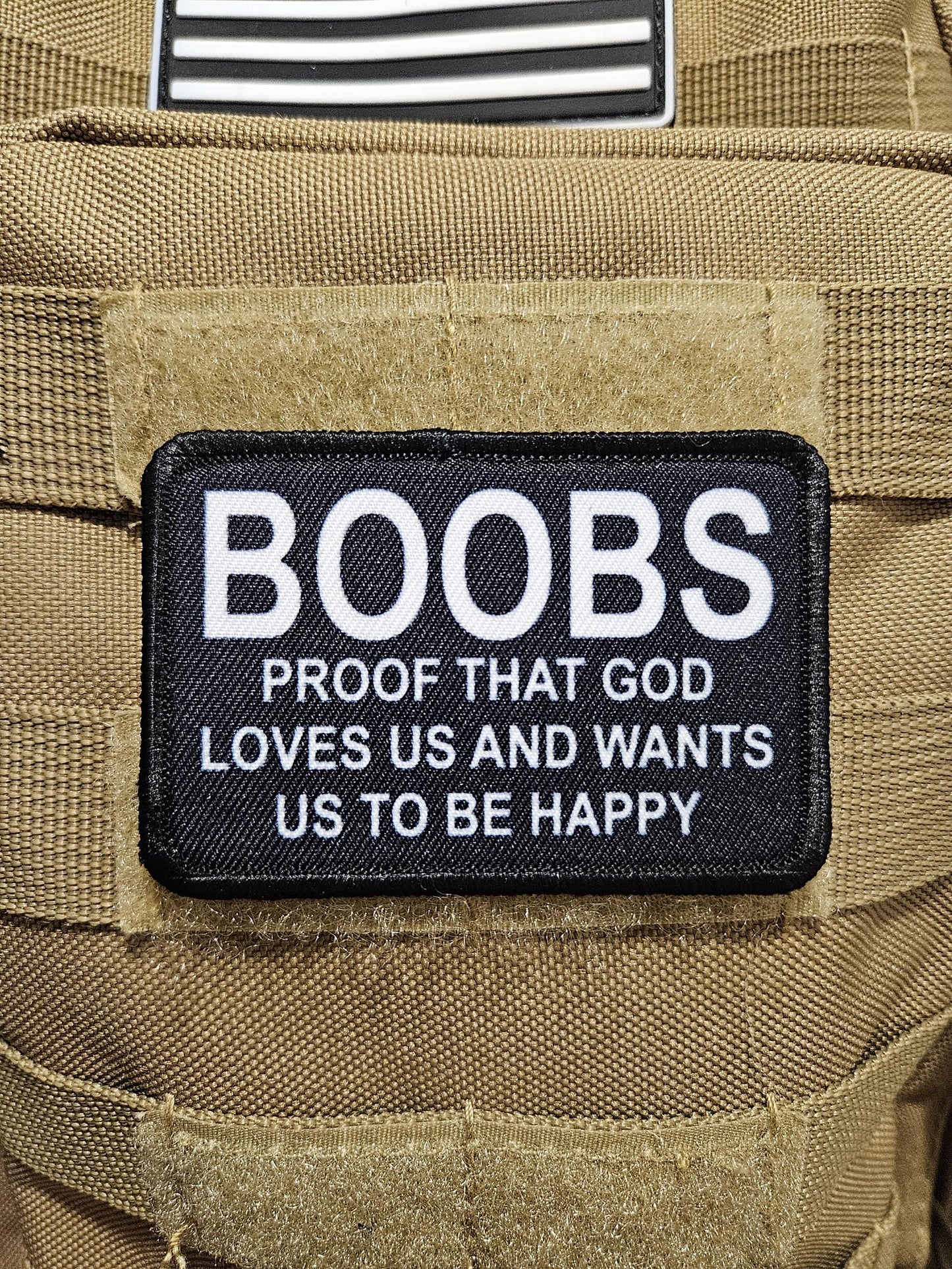 Boobs proof that God loves us and wants us to be happy meme 2"x3" removable morale patch with hook and loop backing black and white
