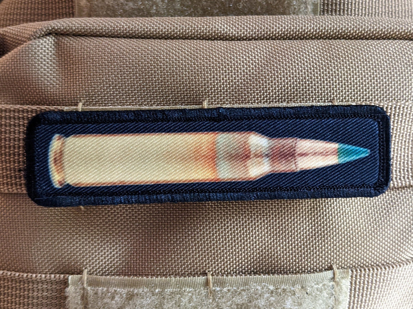 556 green tip round military 1"x4" removable morale patch with hook and loop backing good for back of operator hats