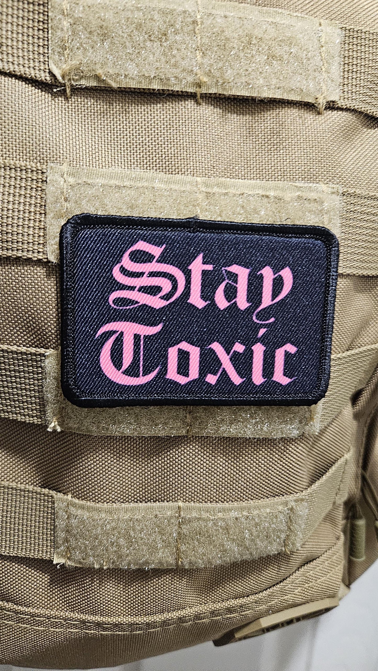 Stay toxic meme  pink on black 2"x3" removable morale patch with hook and loop backing