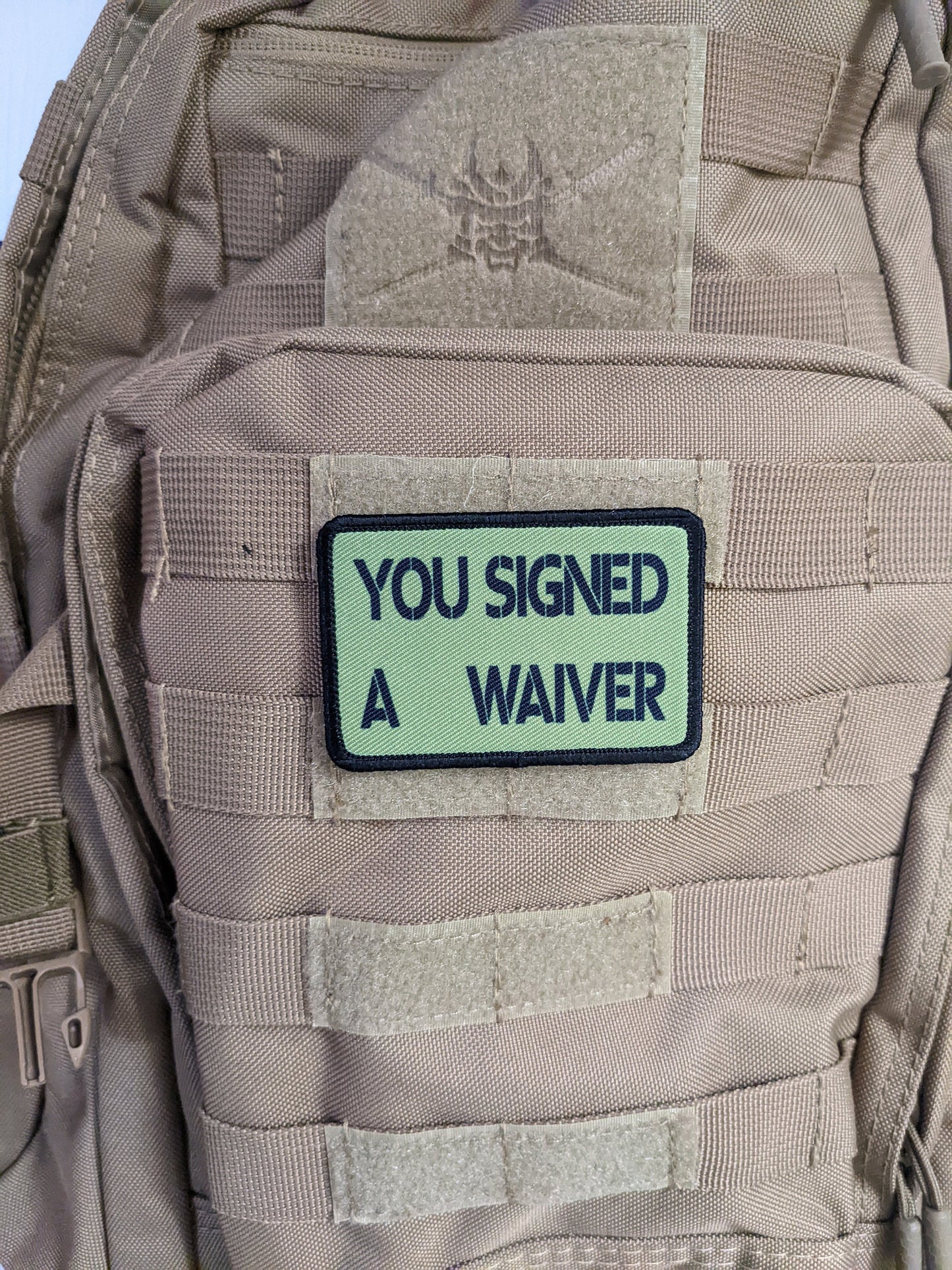 You signed a waiver  removable patch 2"x3" morale patch with hook and loop backing