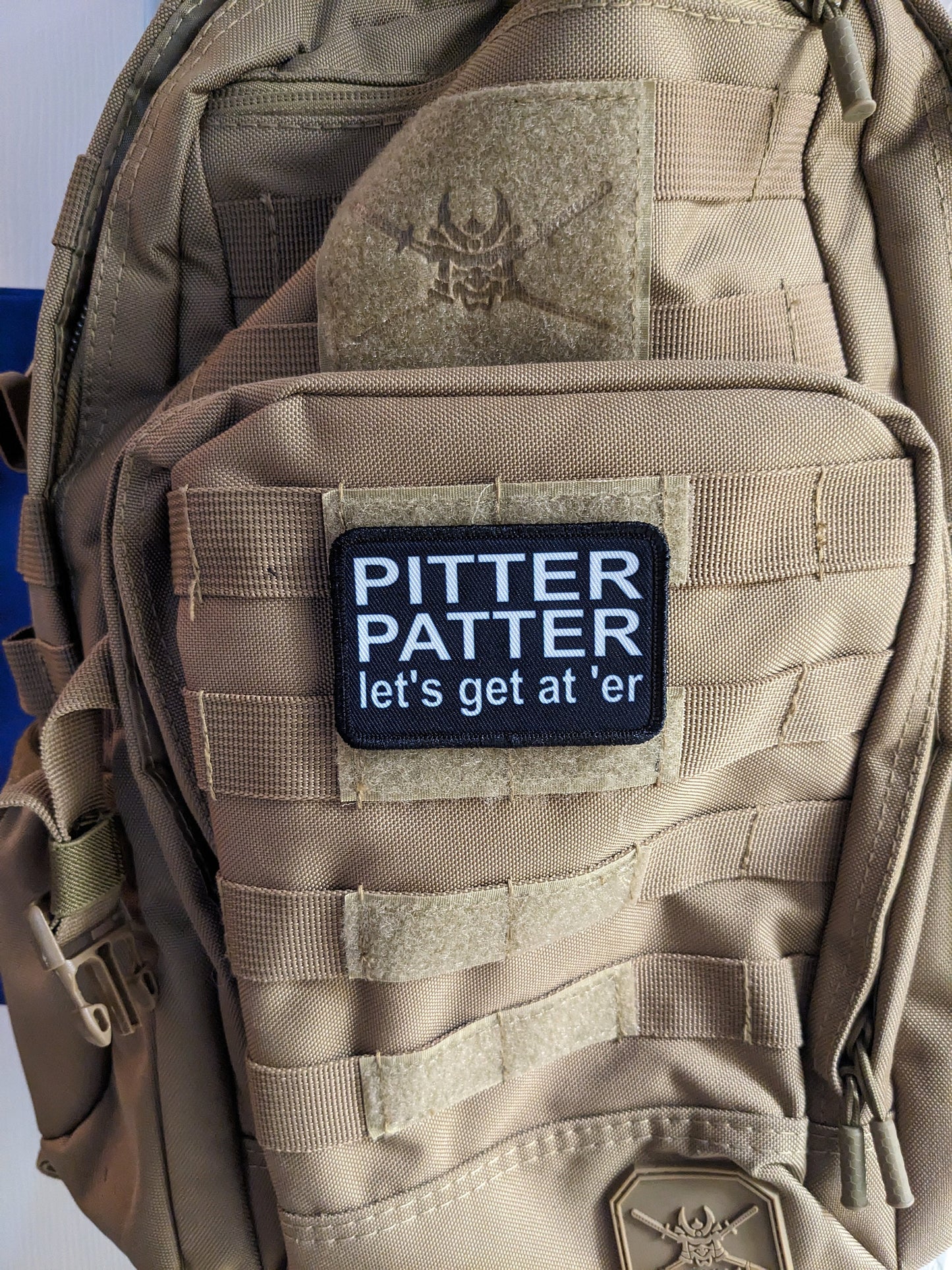 Pitter patter let's get at 'er meme 2"x3" removable morale patch with hook and loop backing black and white