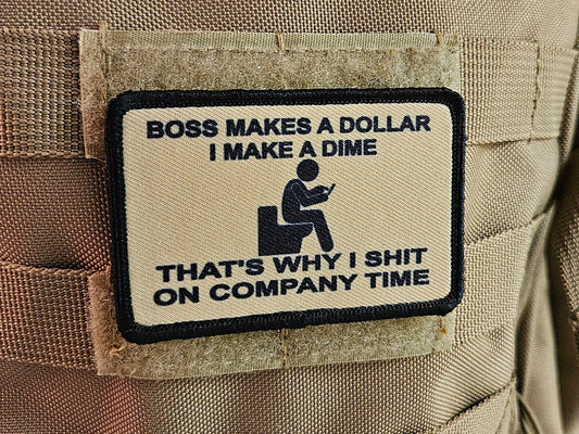 Boss makes a dollar I make a dime that's why I shit on company time 2"x3" morale patch with hook and loop backing tan
