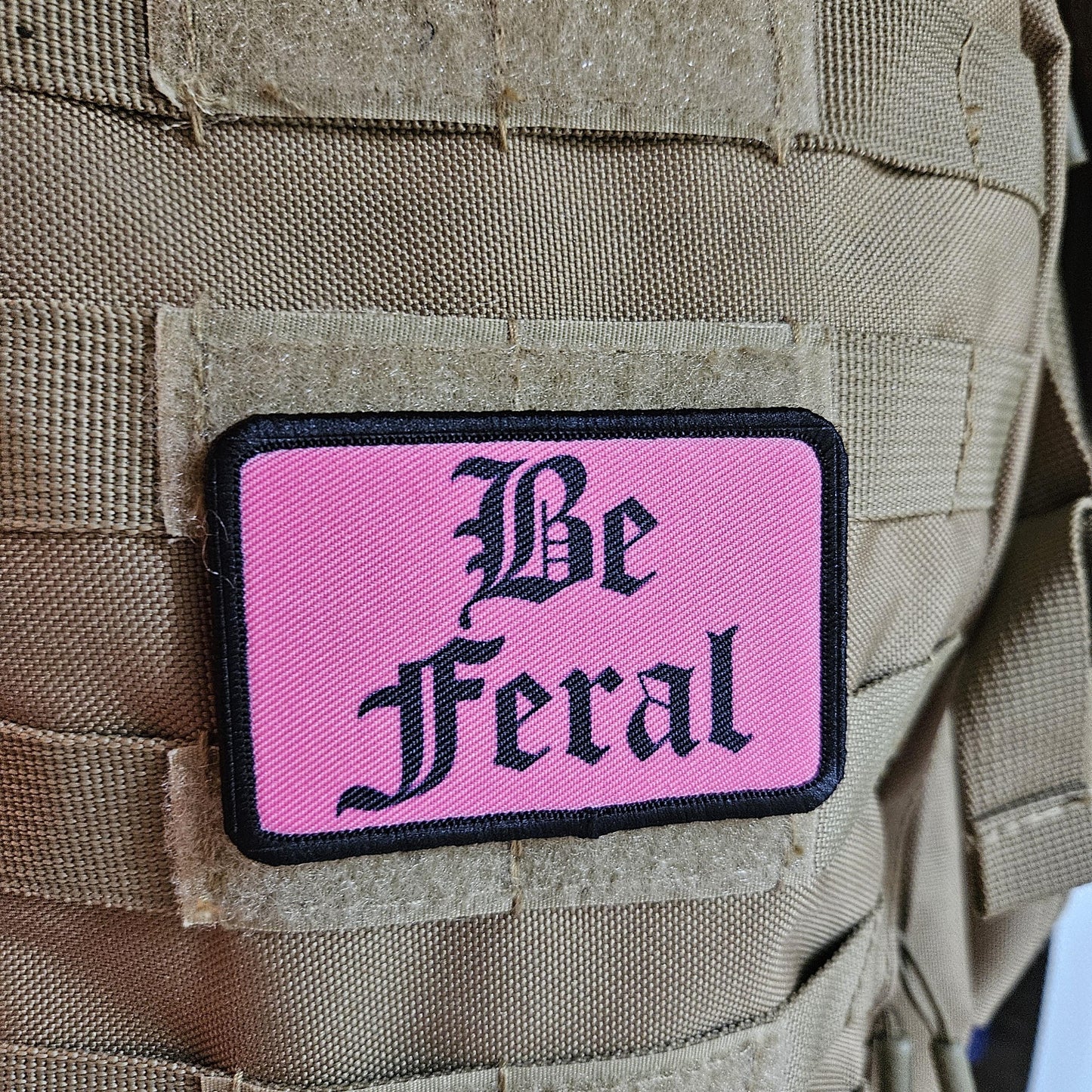 Pink "be feral" girls and boys meme 2"x3" morale patch with hook and loop backing