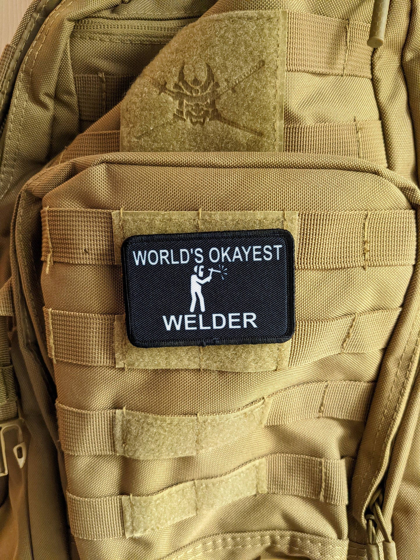 World's okayest Welder blue collar welding 2"x3" morale patch with hook and loop backing