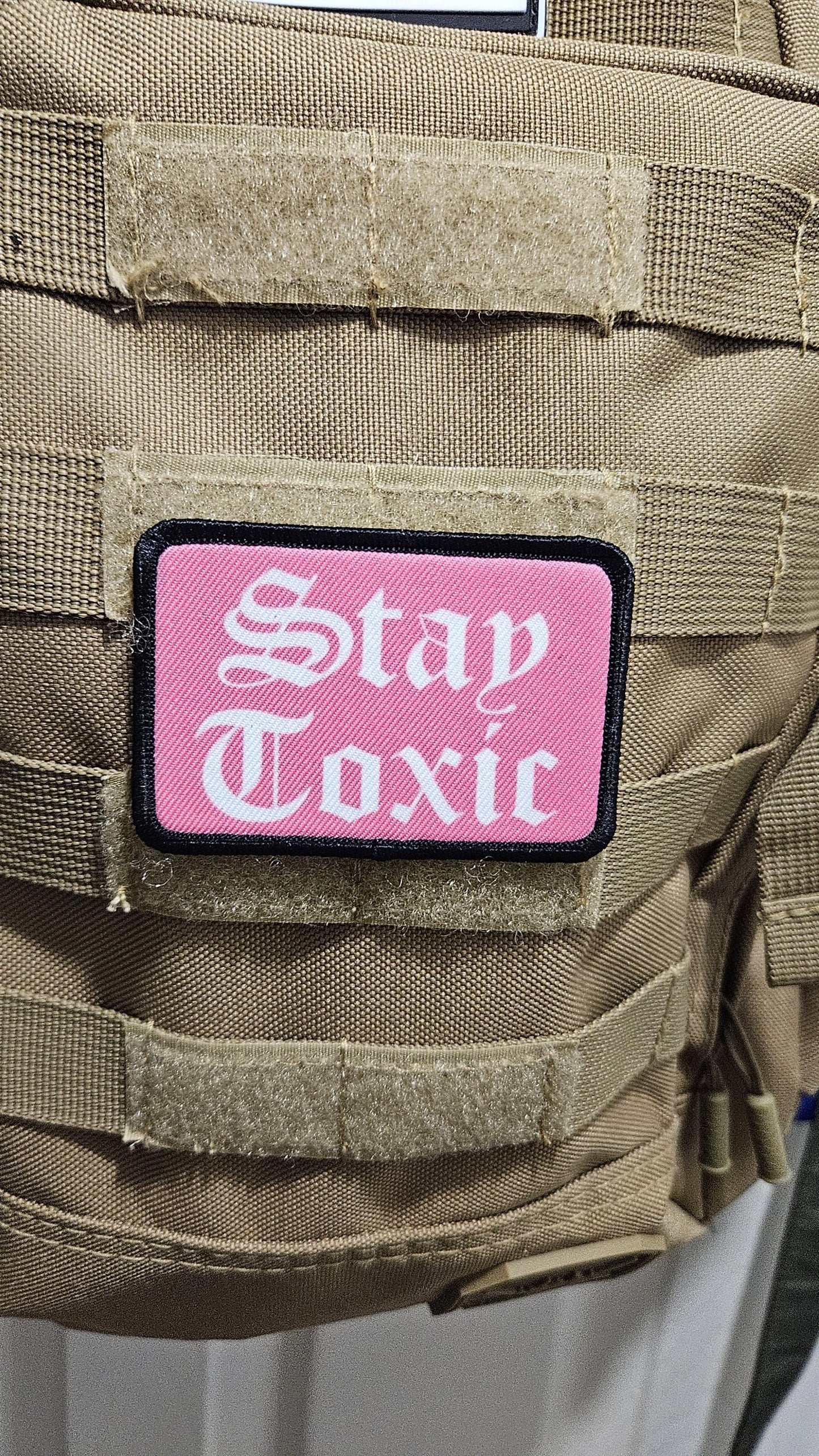 Stay toxic meme  pink and white 2"x3" removable morale patch with hook and loop backing