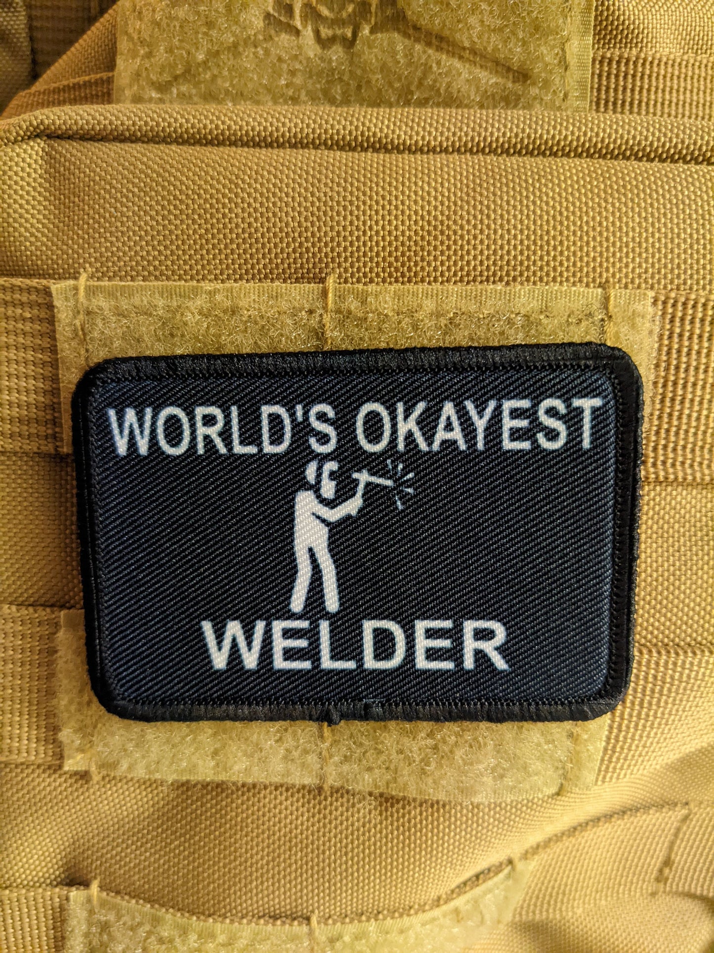 World's okayest Welder blue collar welding 2"x3" morale patch with hook and loop backing