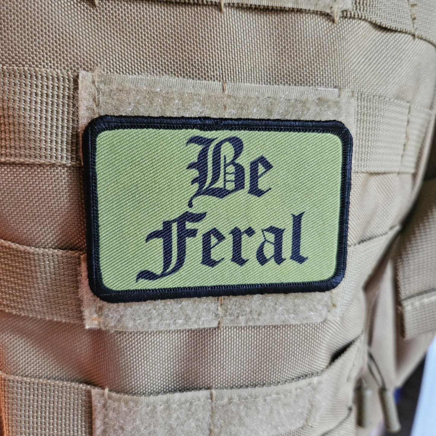Green "be feral" girls and boys meme 2"x3" morale patch with hook and loop backing