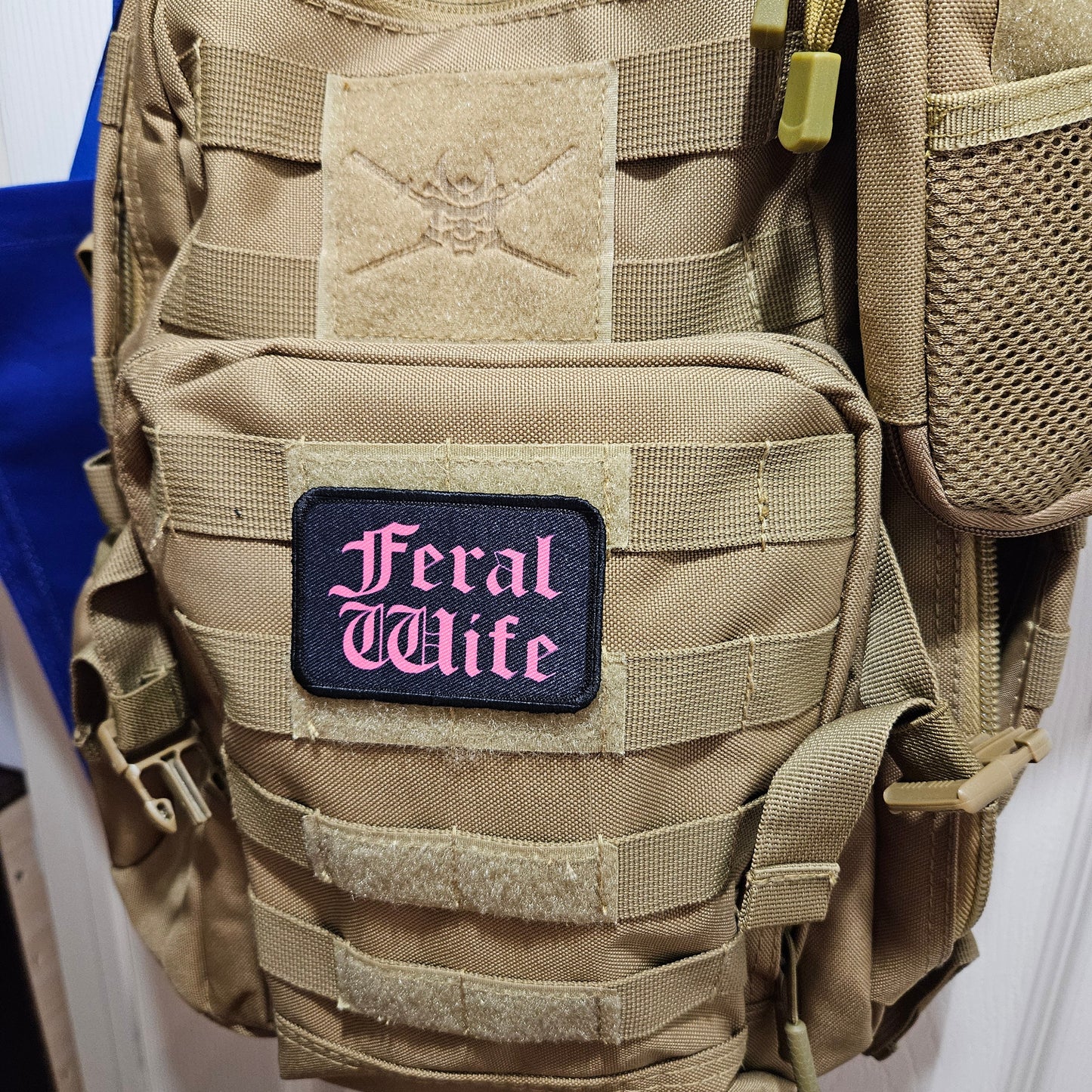 Feral wife meme 2"x3" morale patch with hook and loop backing pink on black