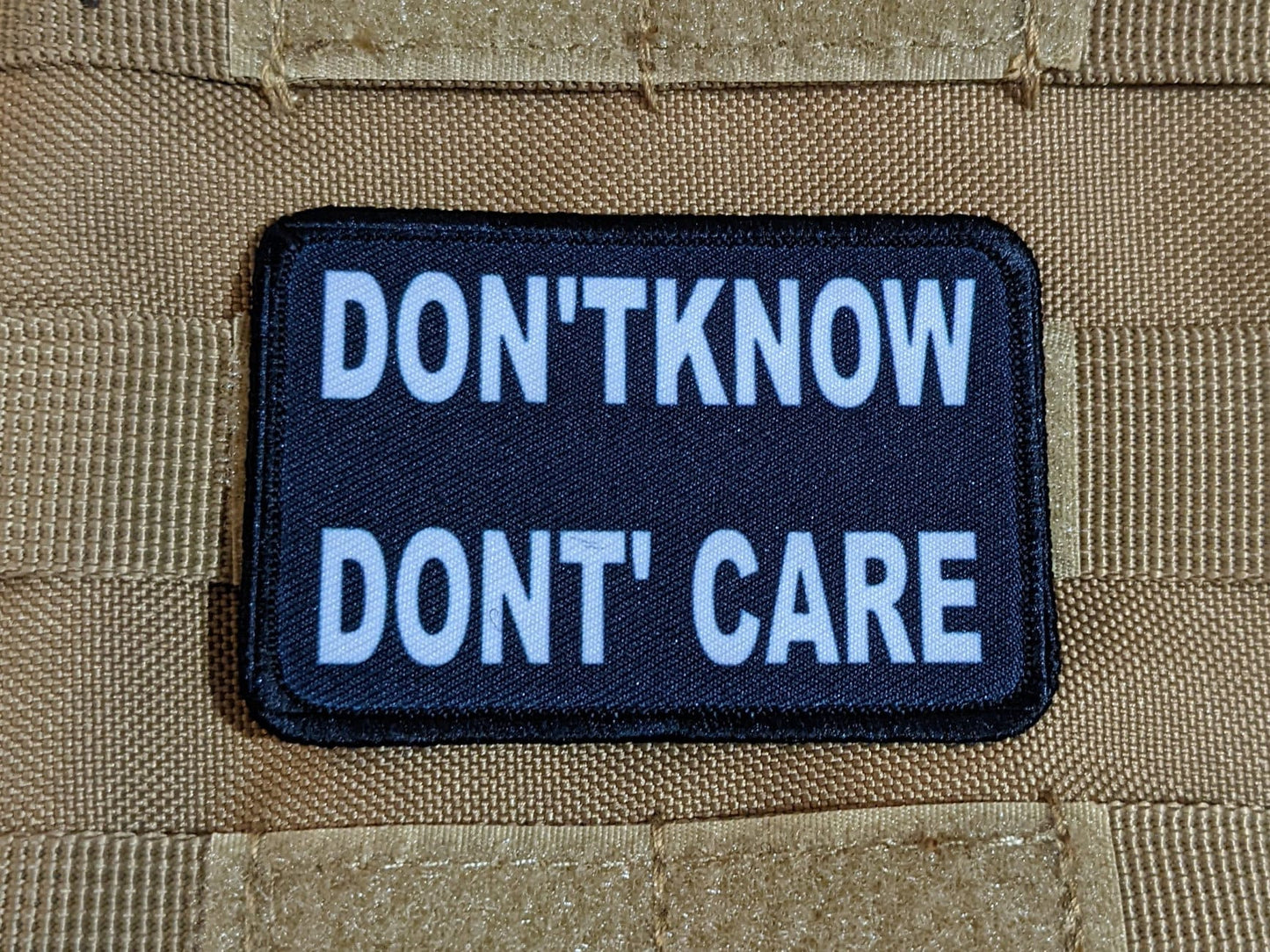 Don't Know Don't Care funny 2"x3" morale patch with hook and loop backing green background
