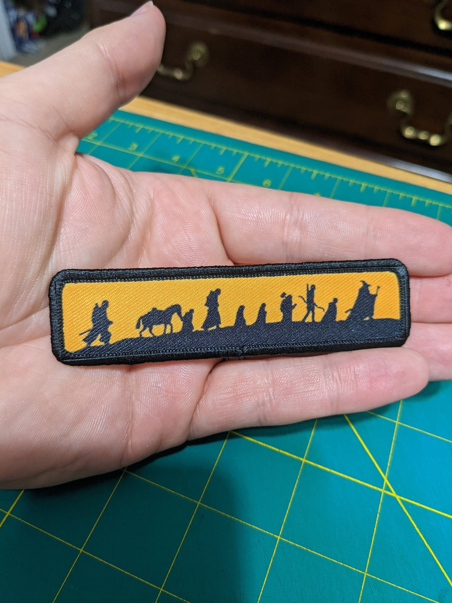 LOTR fellowship silhouette orange 1"x4" removable morale patch with hook and loop backing good for back of operator hats