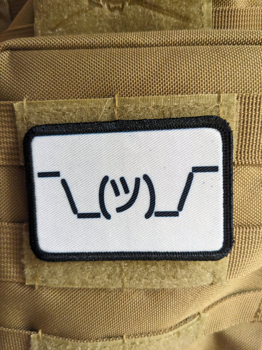 Text idk guy shrugging shoulders white background meme 2"x3" morale patch with hook and loop backing