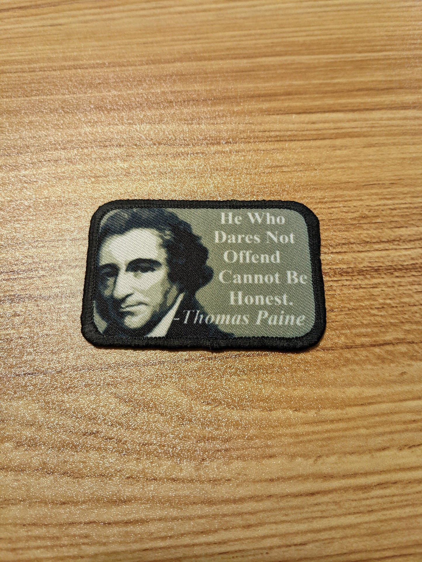Thomas Paine he who does not offend 2"x3" morale patch with hook and loop backing green background