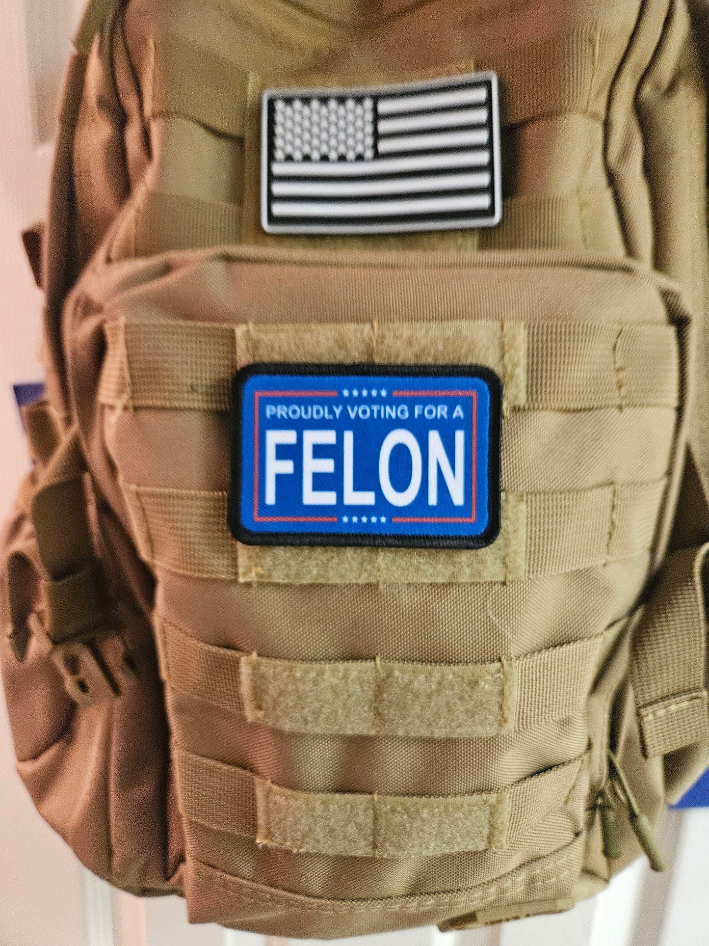 Proudly voting for a felon blue 2"x3" removable morale patch with hook and loop backing meme