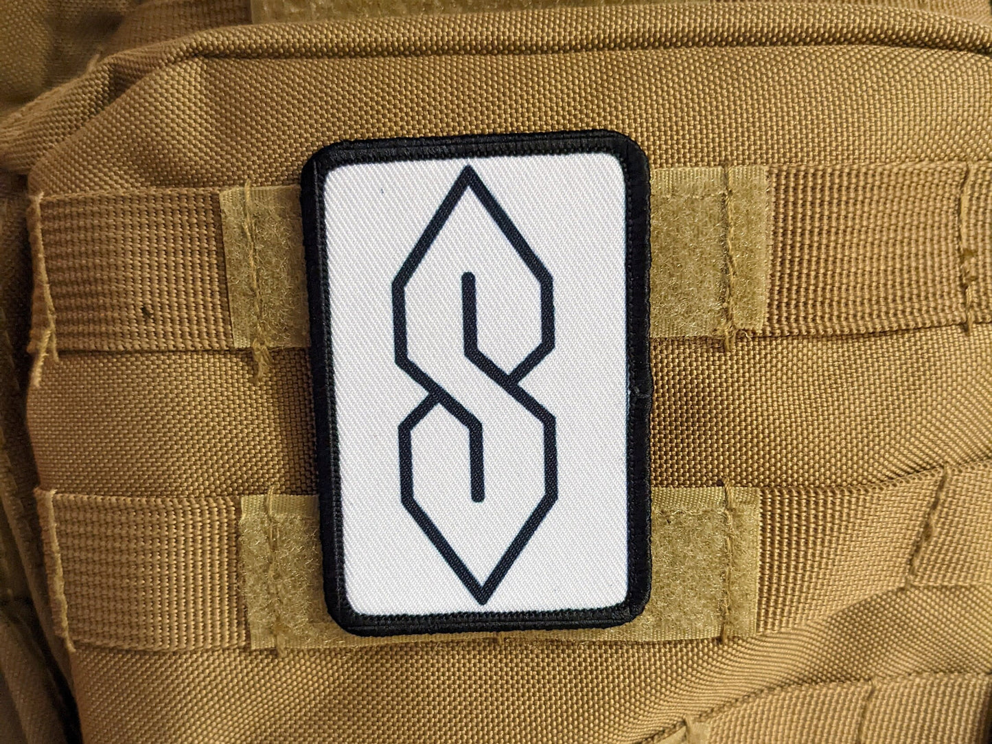 90s "S" shape drawing ancient meme knowledge white 2"x3" morale patch with hook and loop backing