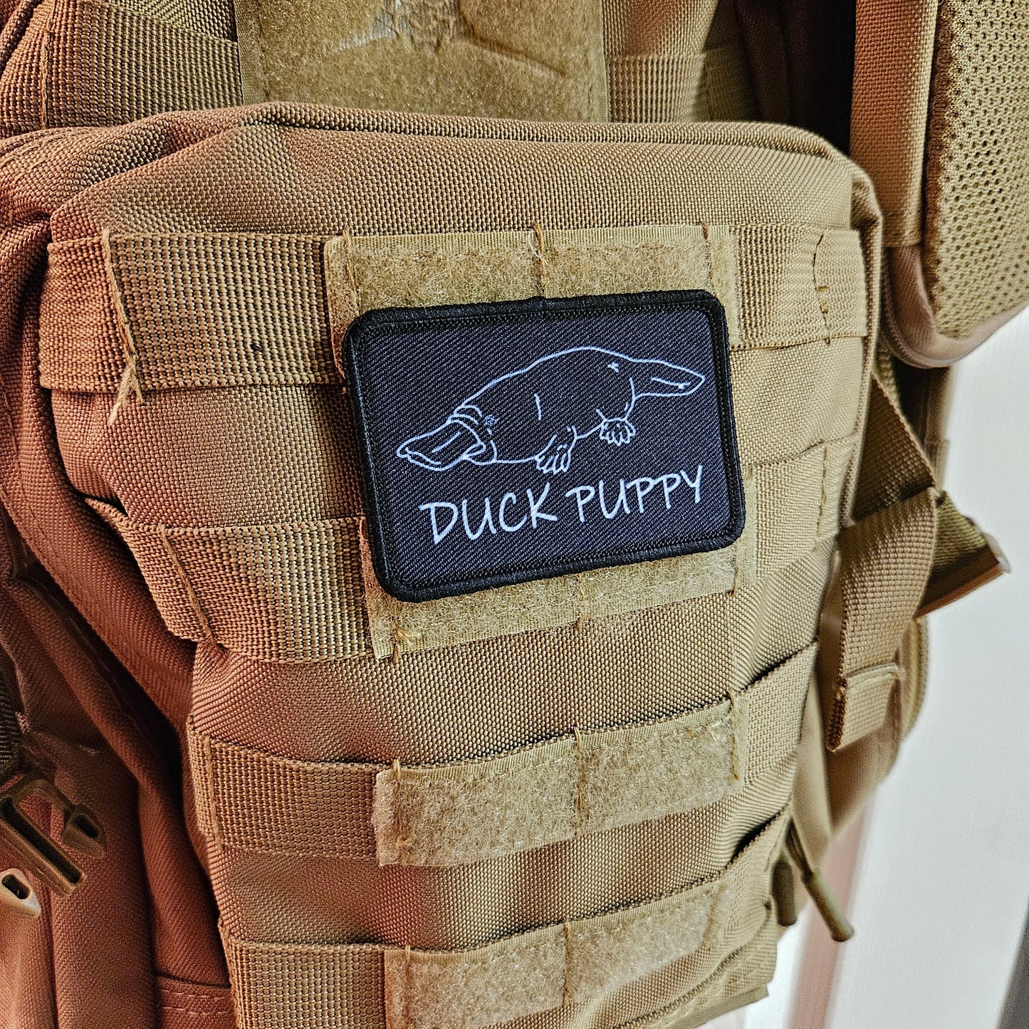 Duck puppy duck billed platypus black meme funny  2"x3" morale patch with hook and loop backing