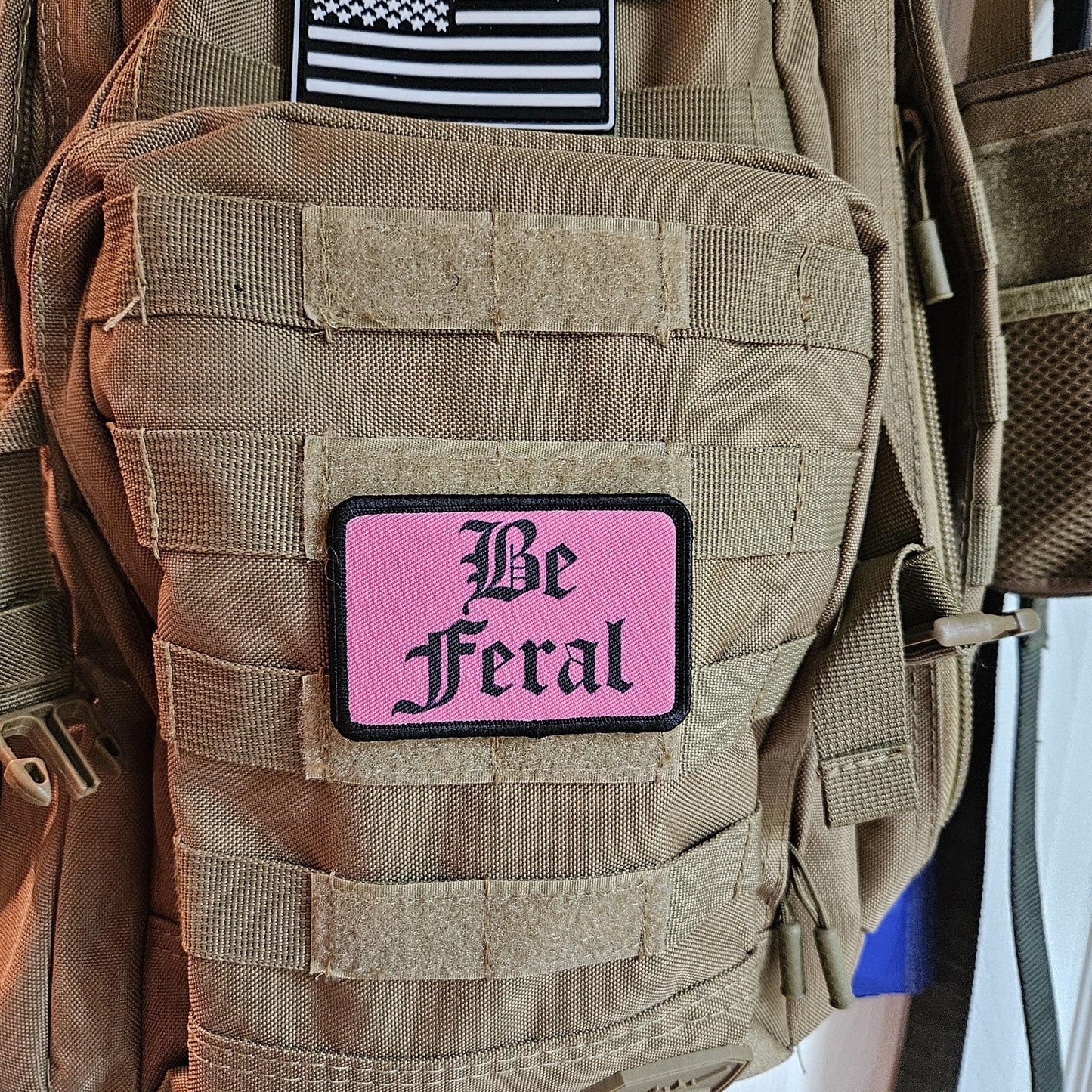 Pink "be feral" girls and boys meme 2"x3" morale patch with hook and loop backing