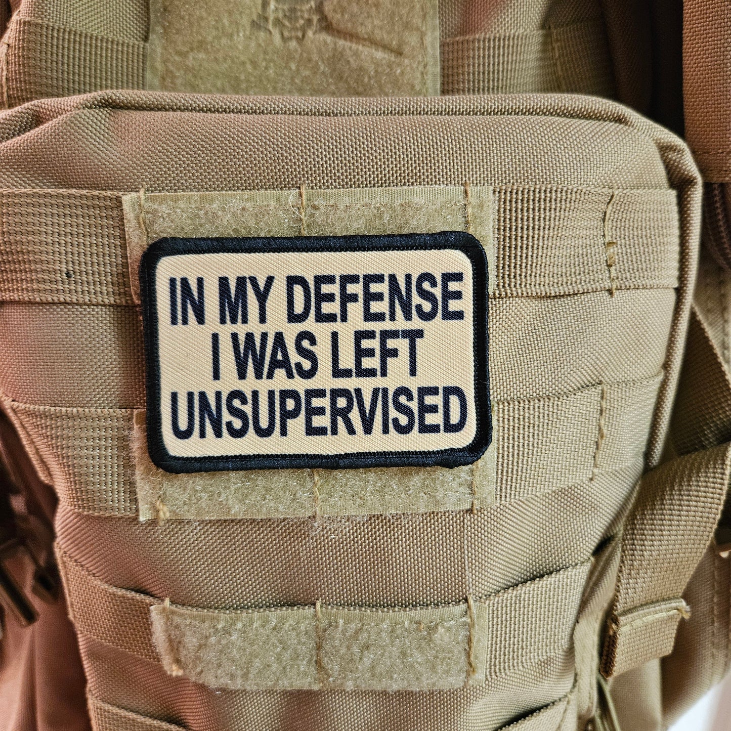 Tan In My Defense I was left Unsupervised  removable patch 2"x3" morale patch with hook and loop backing