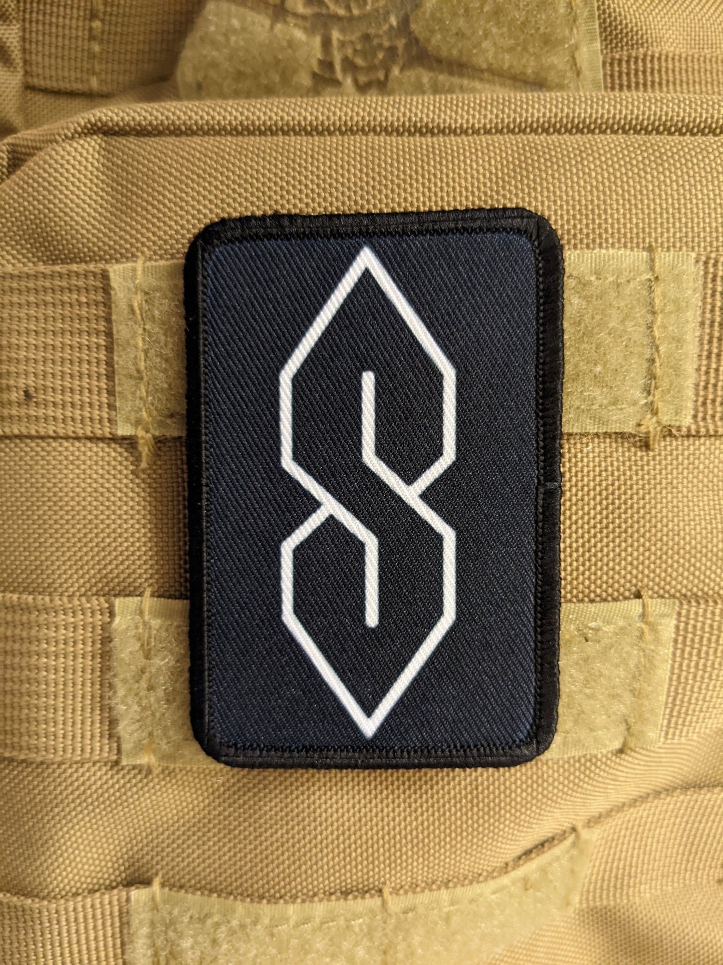 90s "S" shape drawing ancient meme knowledge 2"x3" morale patch with hook and loop backing