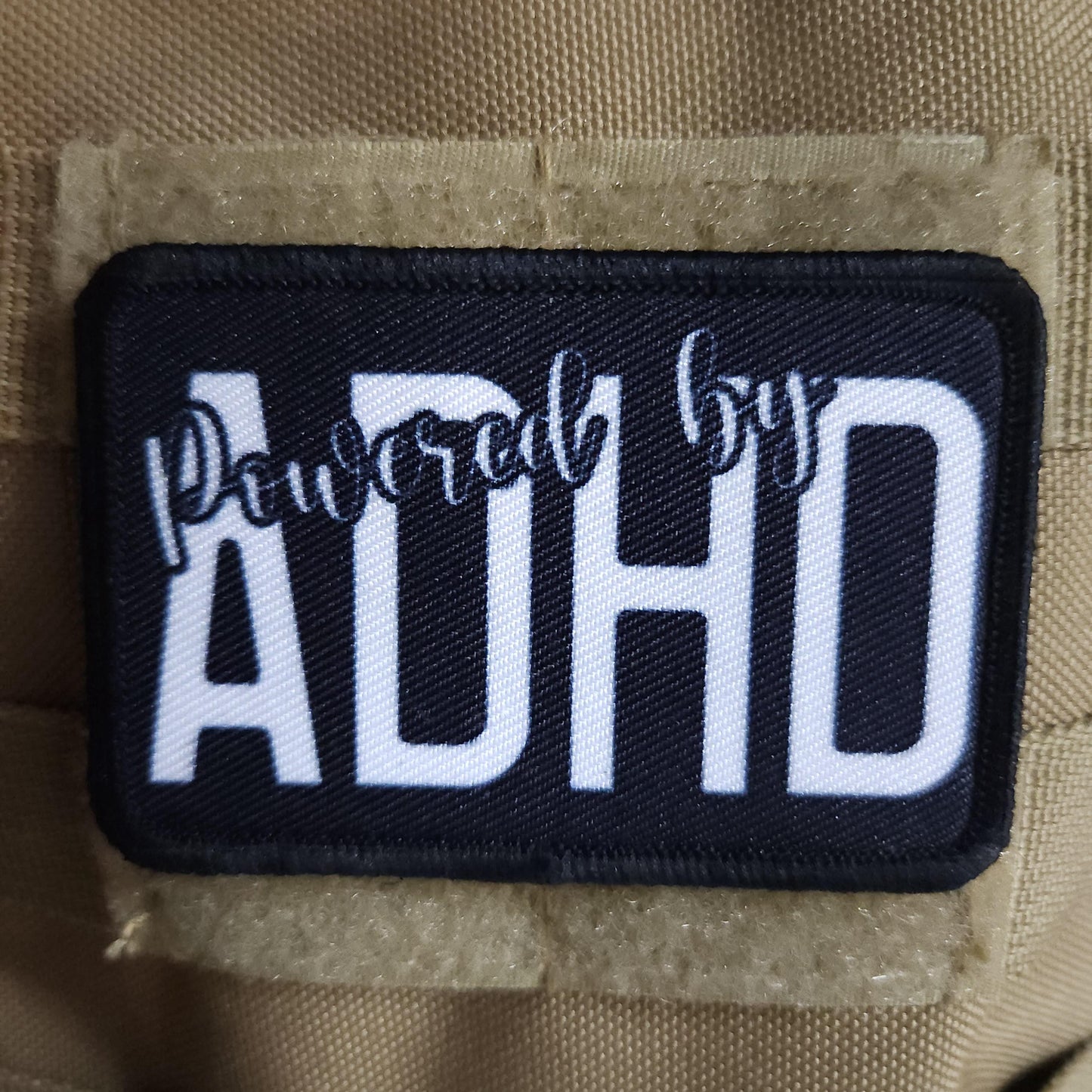 Powered by ADHD meme  2"x3" morale patch with hook and loop backing