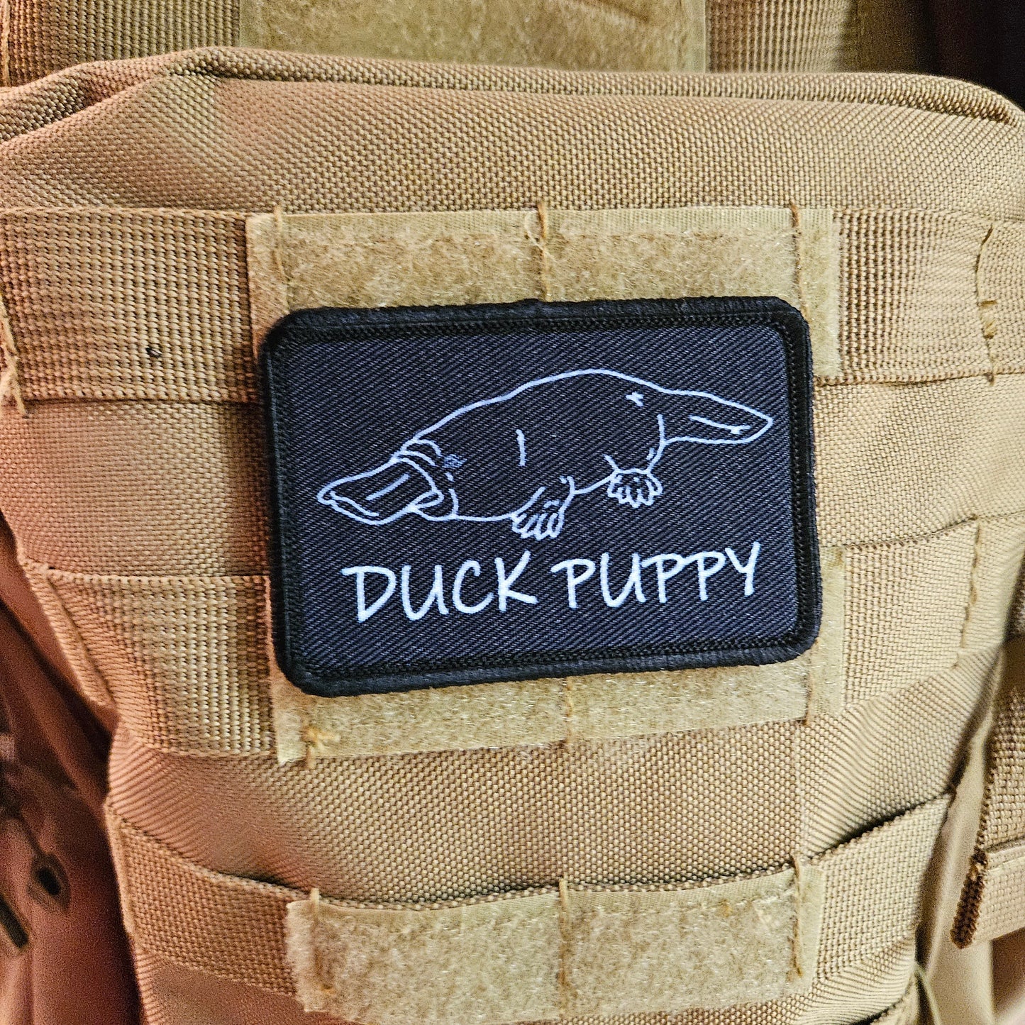 Duck puppy duck billed platypus black meme funny  2"x3" morale patch with hook and loop backing