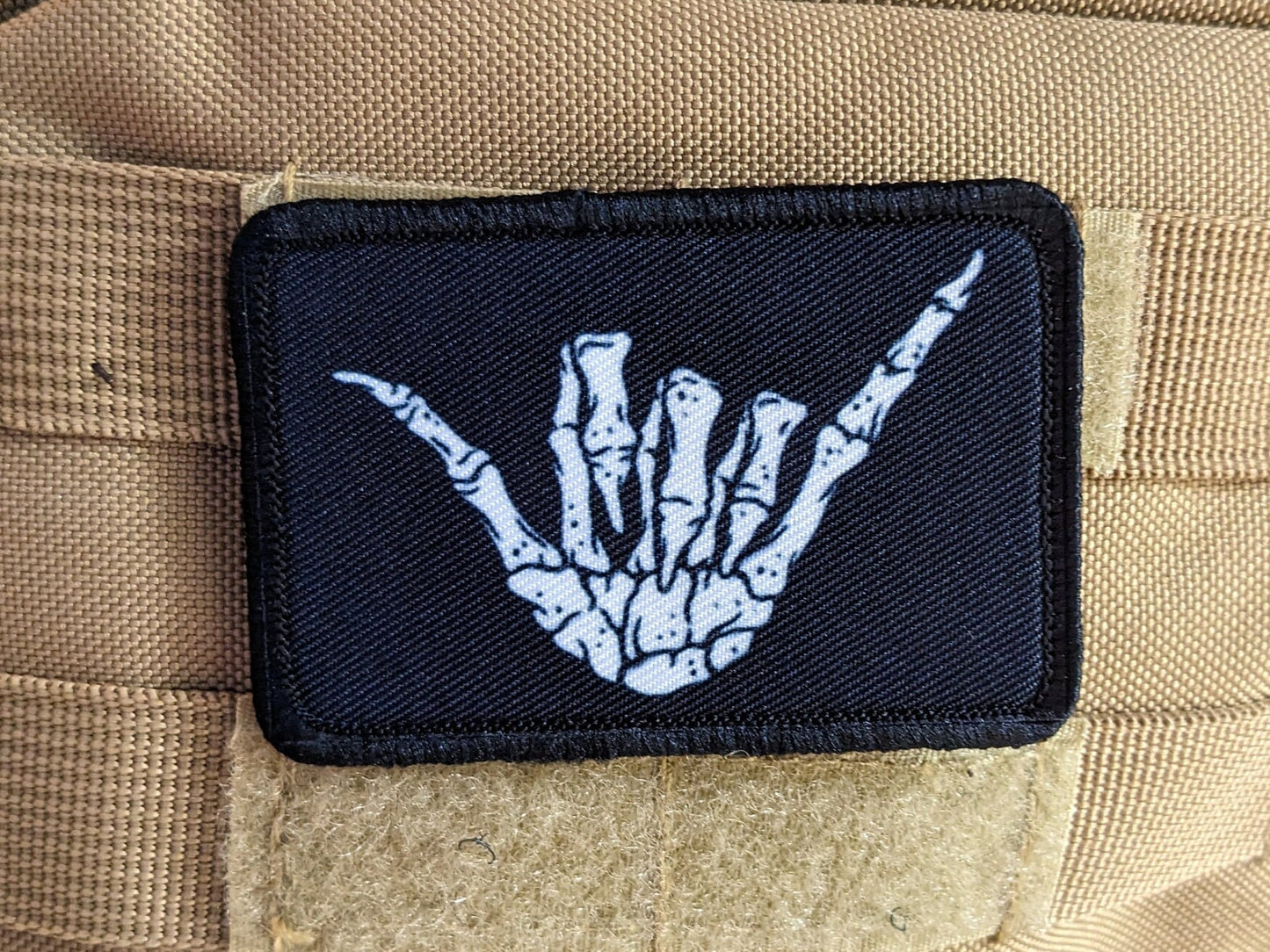 Bone shaka punk goth joke 2"x3" white morale patch with hook and loop backing