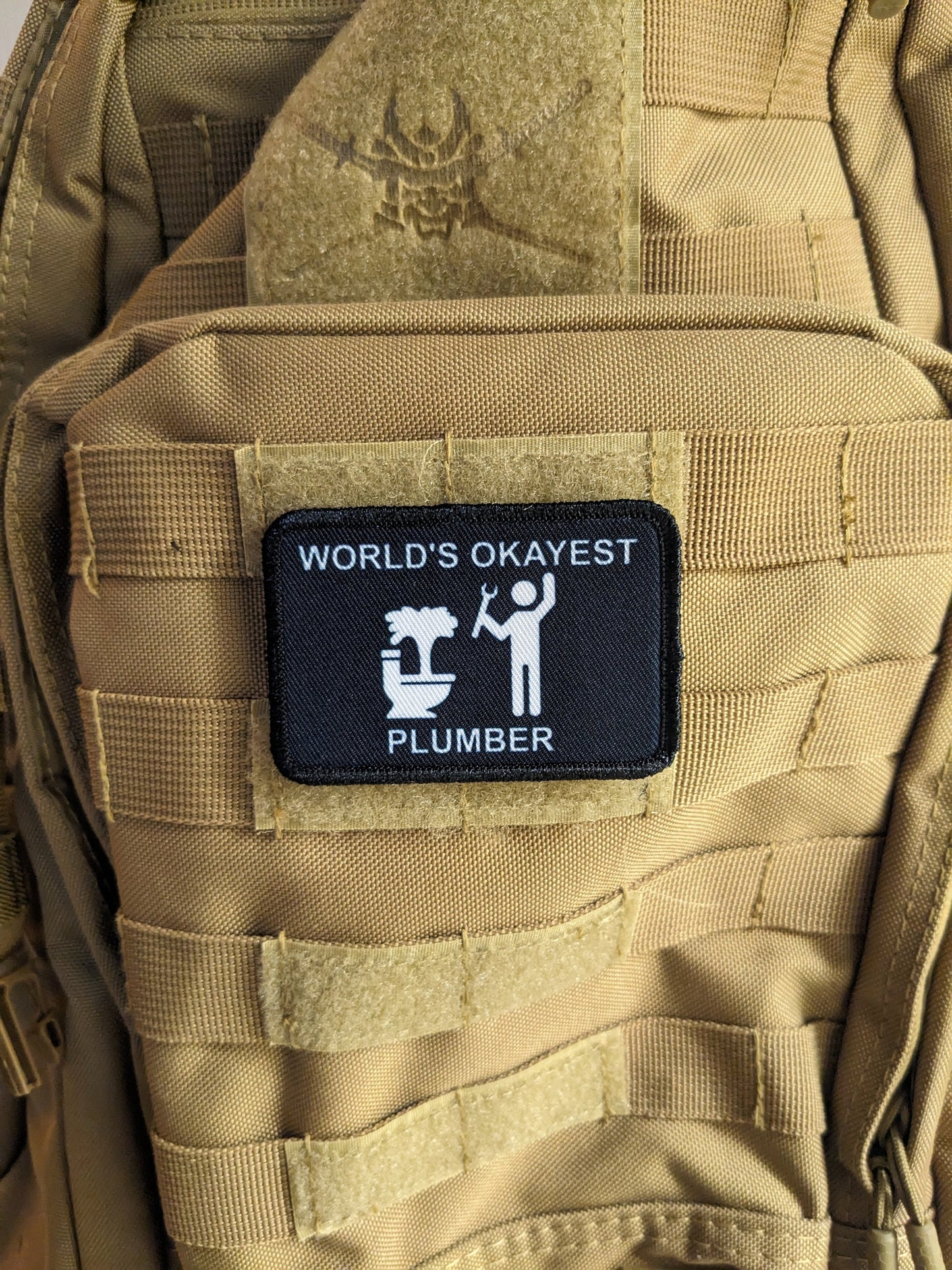 World's okayest plumber blue collar welding 2"x3" morale patch with hook and loop backing