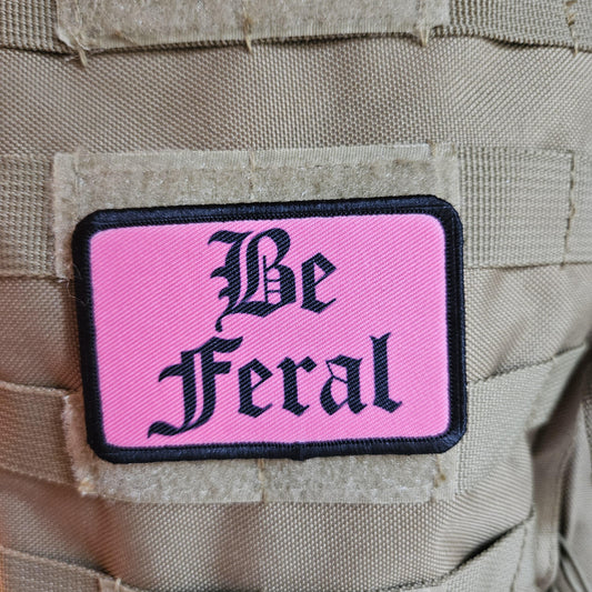 Pink "be feral" girls and boys meme 2"x3" morale patch with hook and loop backing