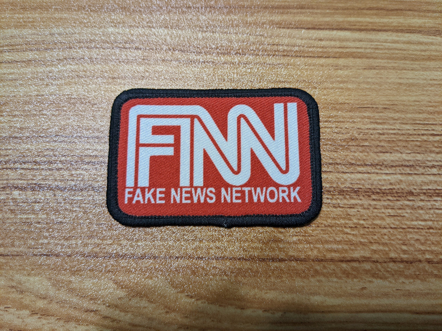 Fake News Network FNN cnn sucks 2"x3" morale patch with hook and loop backing