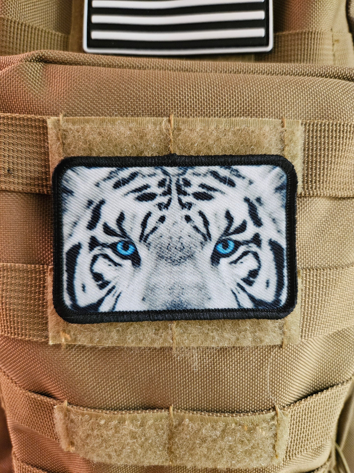 White tiger eyes 2"x3" morale patch with hook and loop backing