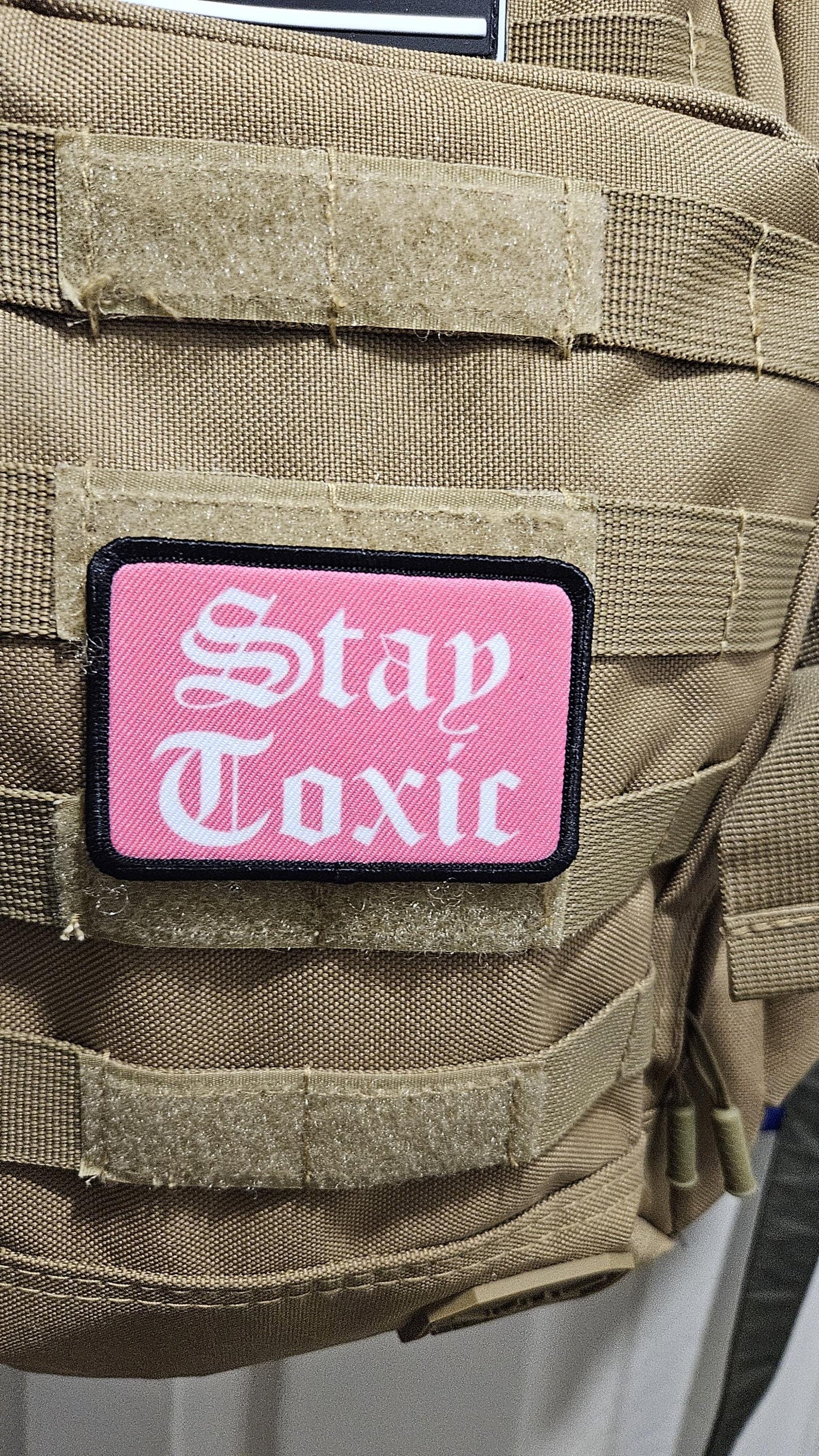 Stay toxic meme  pink and white 2"x3" removable morale patch with hook and loop backing